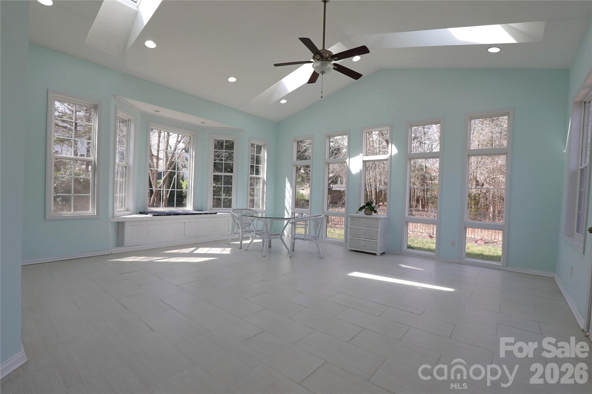 Sunroom with so much natural light to enjoy and a mini split to heat and cool the space year round - 18465 E Marbella Lane, Fort Mill