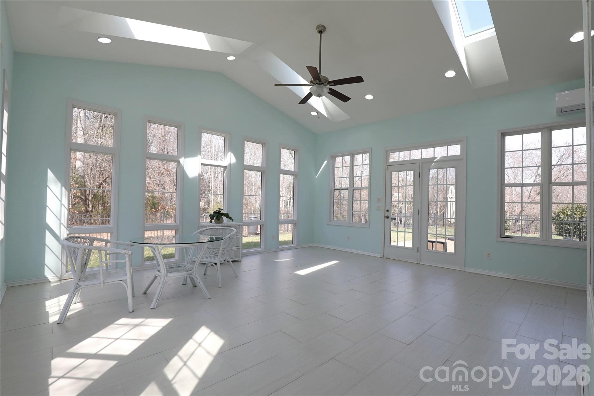 Sunroom with so much natural light to enjoy and a mini split to heat and cool the space year round - 18465 E Marbella Lane, Fort Mill
