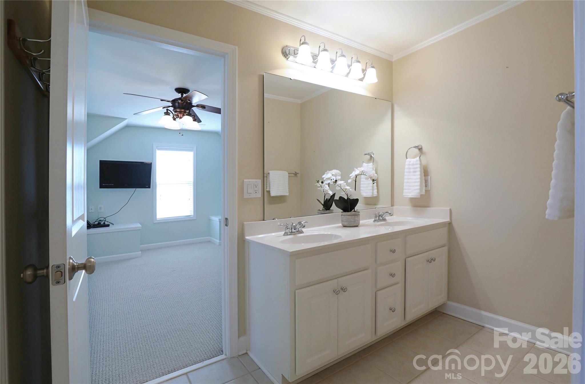 Upstairs Jack and Jill bathroom has dual vanity and separate door to tub and toilet - 18465 E Marbella Lane, Fort Mill