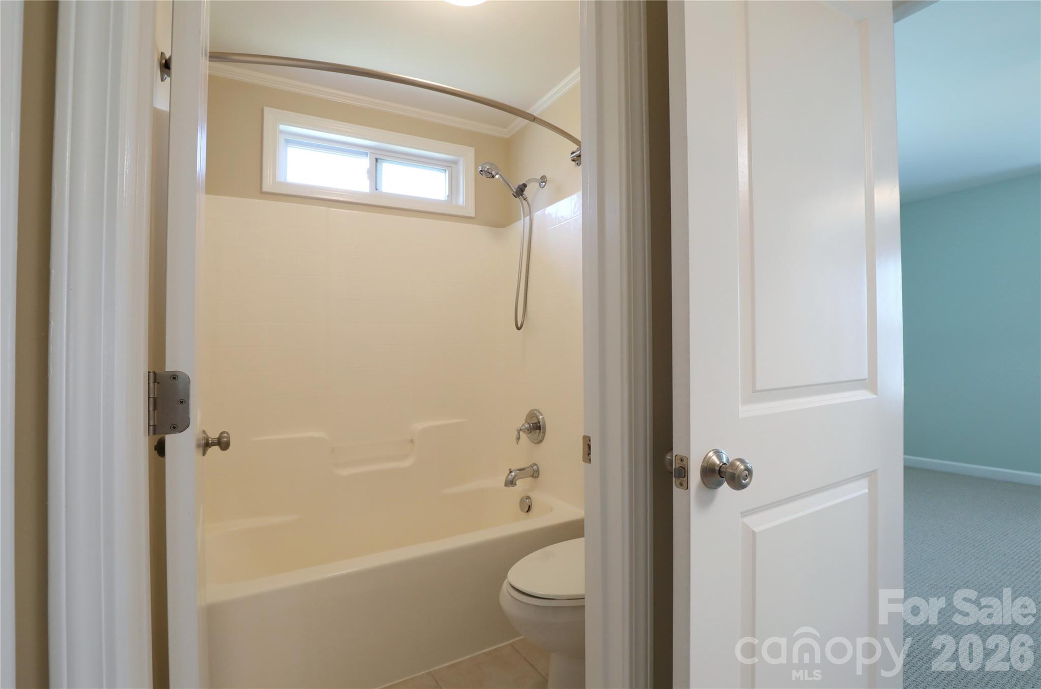 Upstairs Jack and Jill bathroom has dual vanity and separate door to tub and toilet - 18465 E Marbella Lane, Fort Mill
