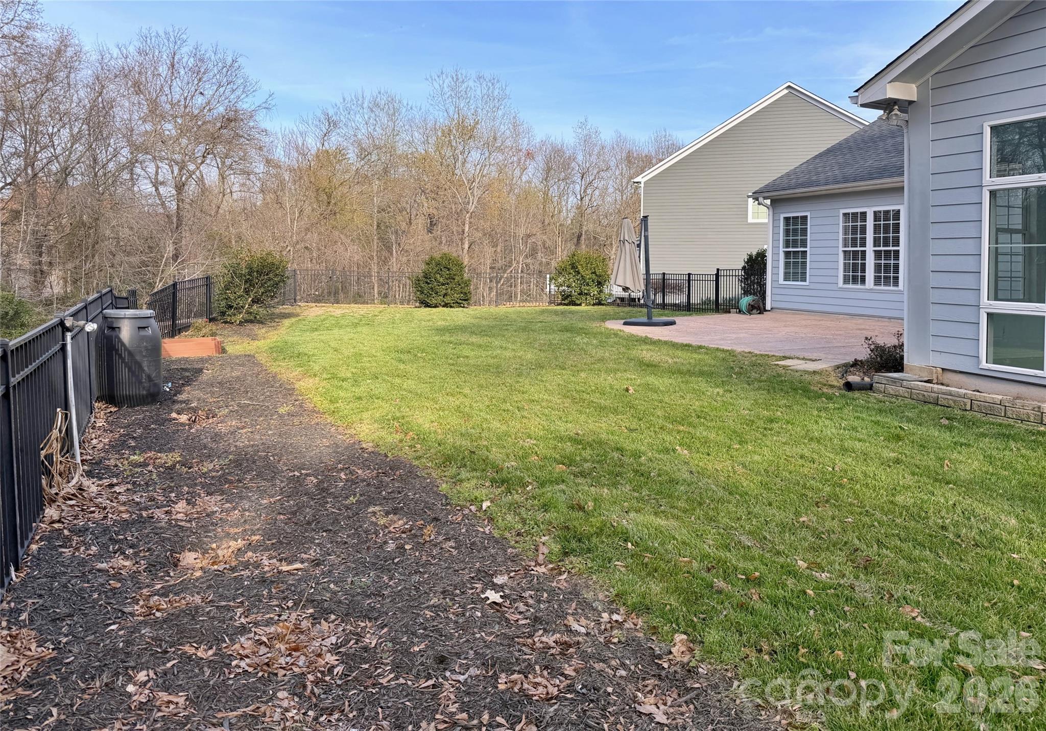 Level rear yard is spacious with room to garden and personalize - 18465 E Marbella Lane, Fort Mill
