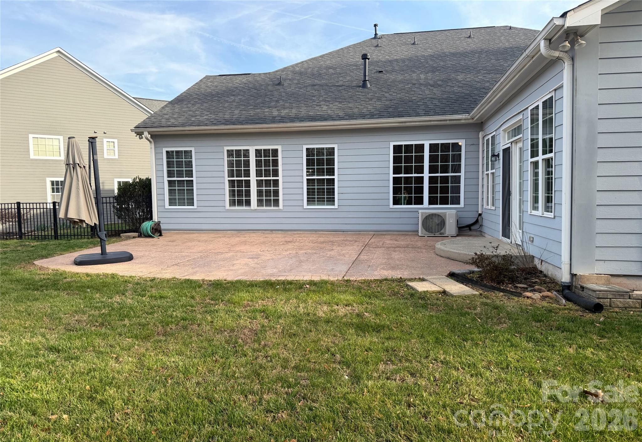 Large rear patio accessbile from sunroom - 18465 E Marbella Lane, Fort Mill