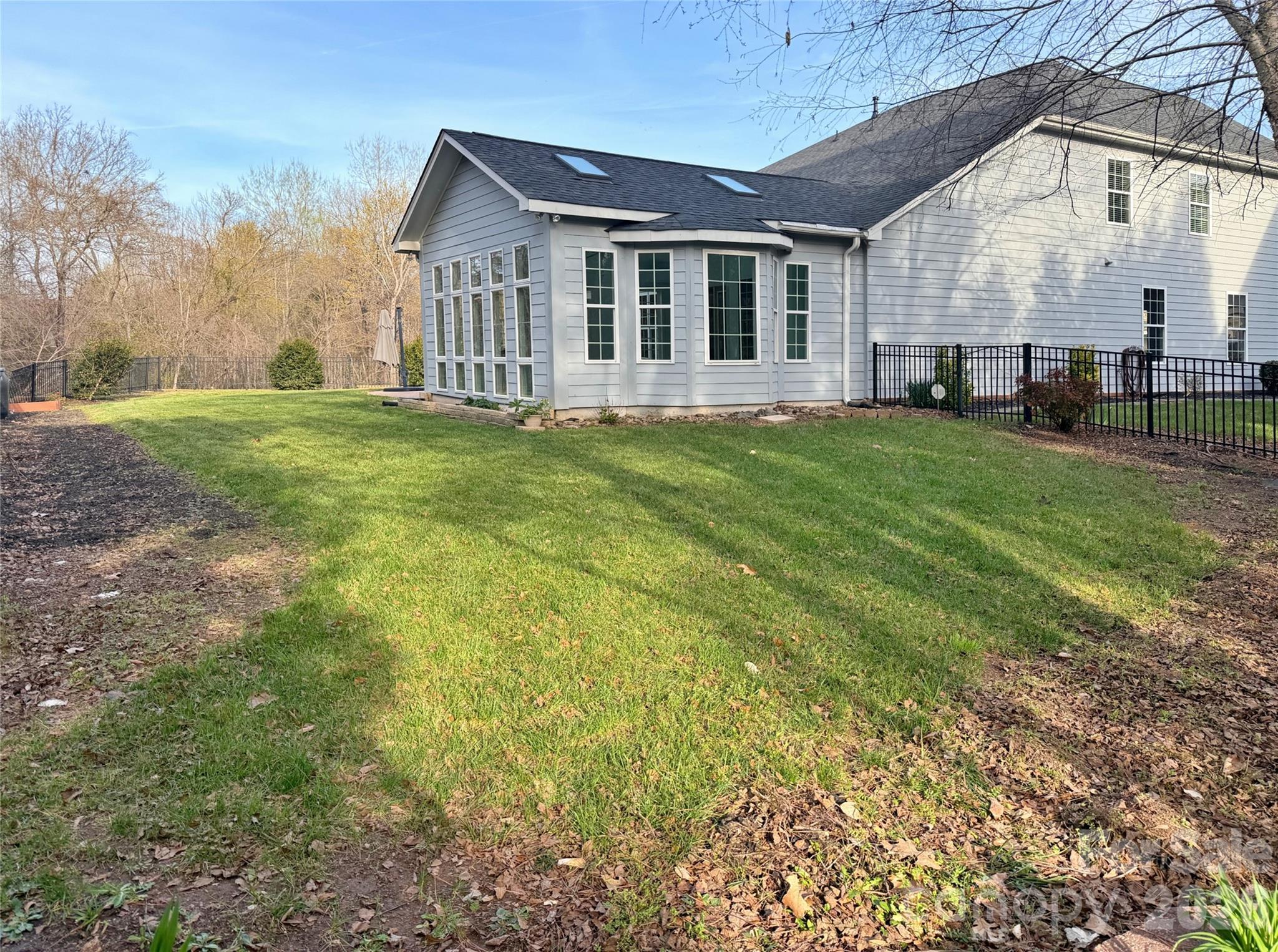 Fenced, level rear yard is spacious with room to garden and personalize - 18465 E Marbella Lane, Fort Mill