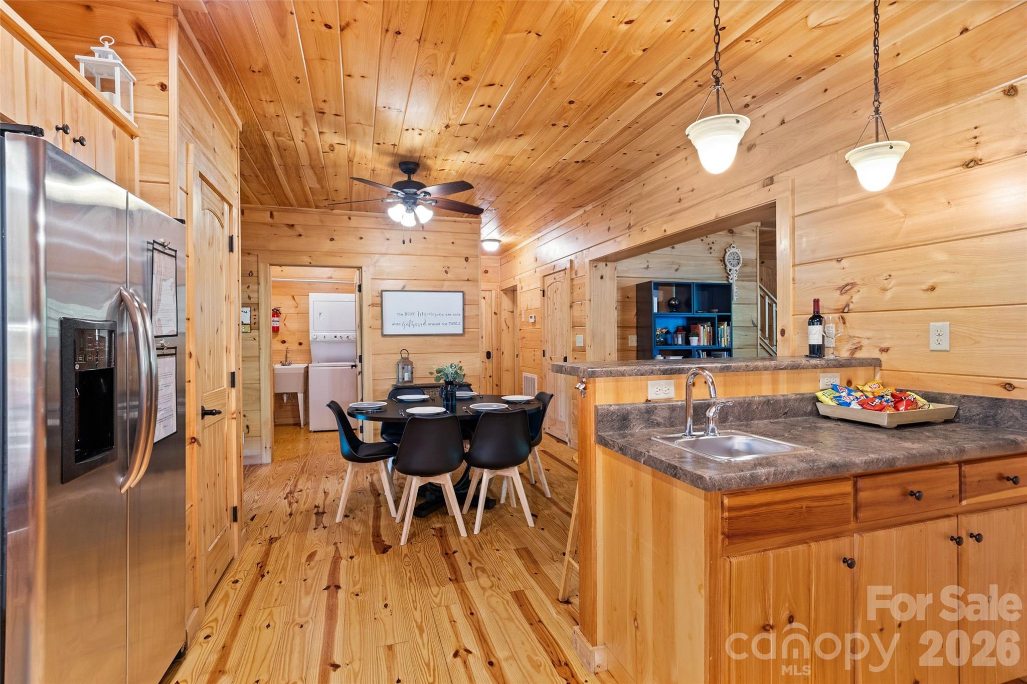 Open kitchen/dining layout. - 213 Big Valley Road, Pisgah Forest