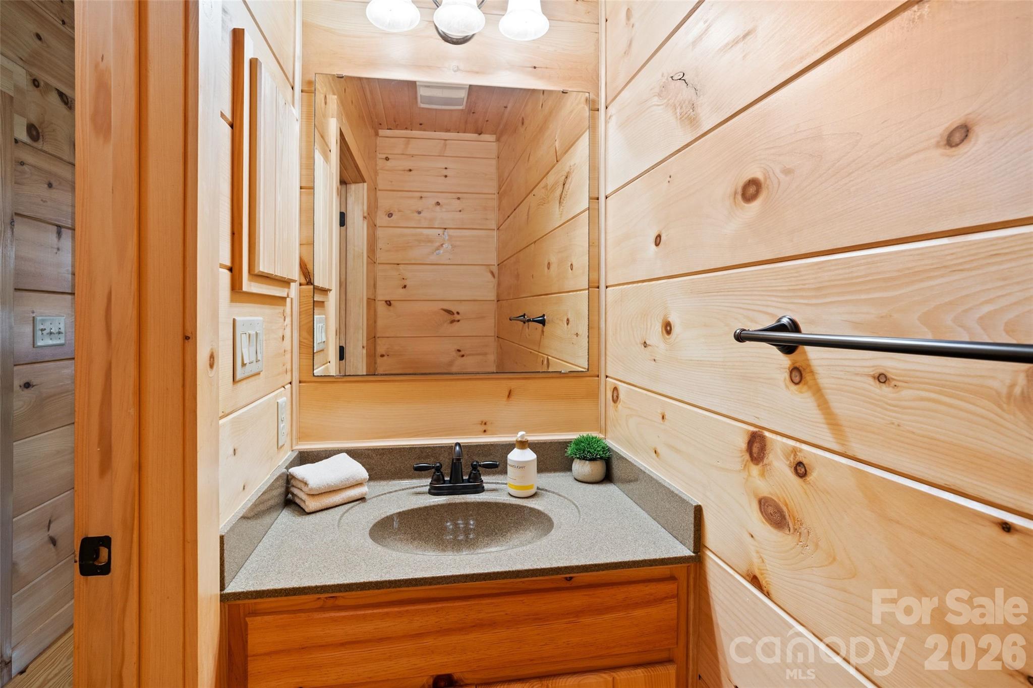 Half bath on the main level. - 213 Big Valley Road, Pisgah Forest