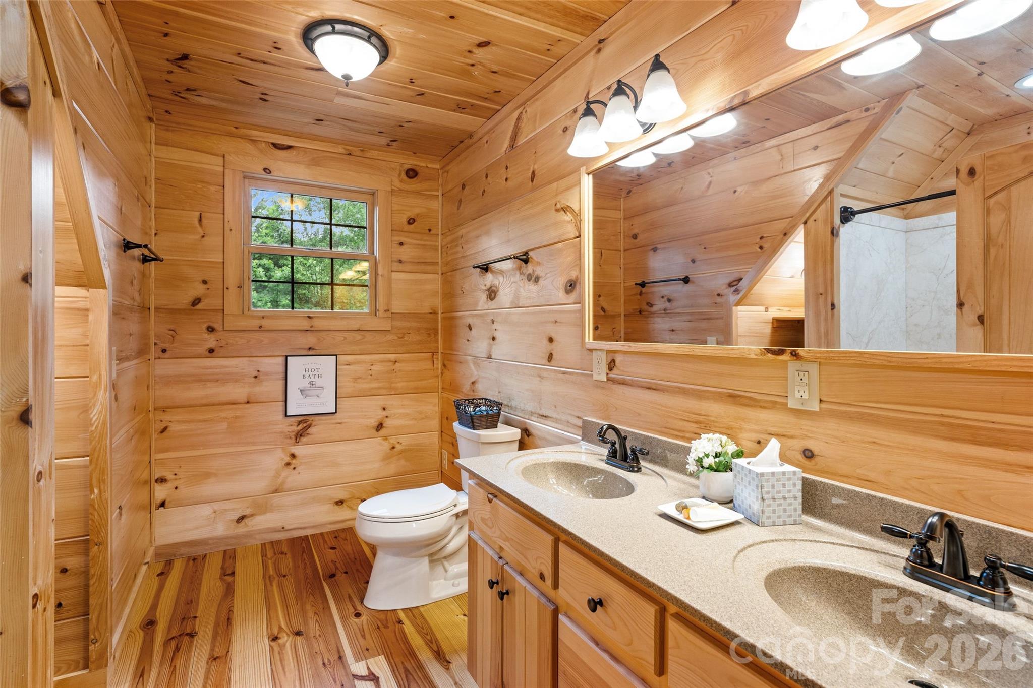 Another great bathroom upstairs with double sinks. No one has to wait to get ready around here. - 213 Big Valley Road, Pisgah Forest