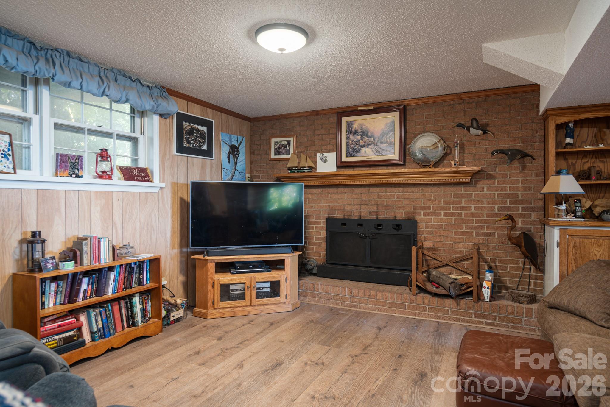 cozy basement with fireplace - 7889 Tradewinds Drive, Sherrills Ford