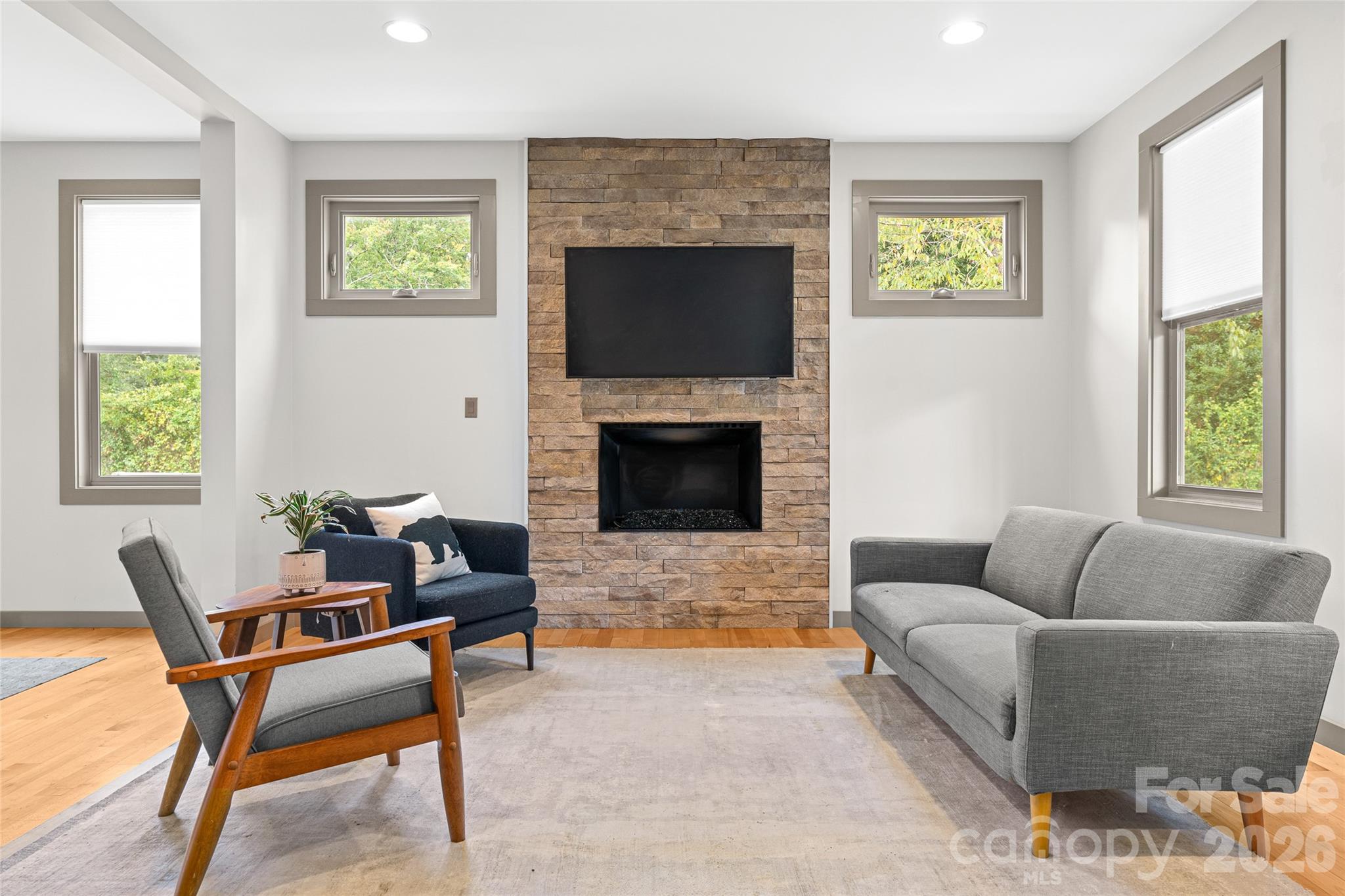 Living Room with Gas Fireplace - 408 Old Haw Creek Road, Asheville