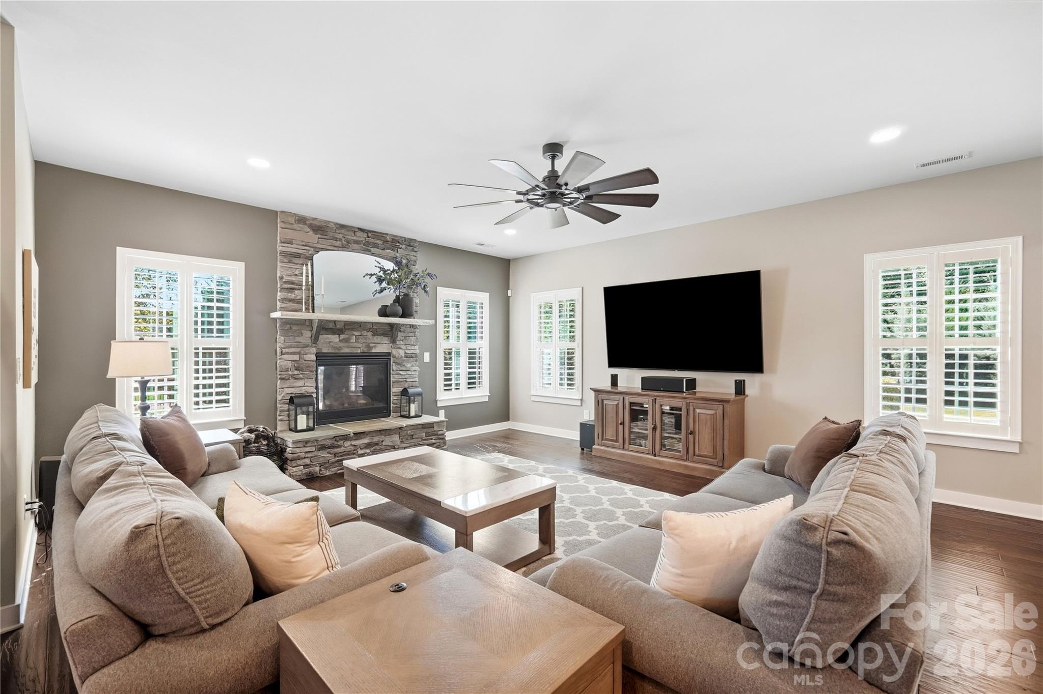Spacious family room with abundant natural light and plenty of room for large gatherings. - 912 Manorwood Drive, Waxhaw