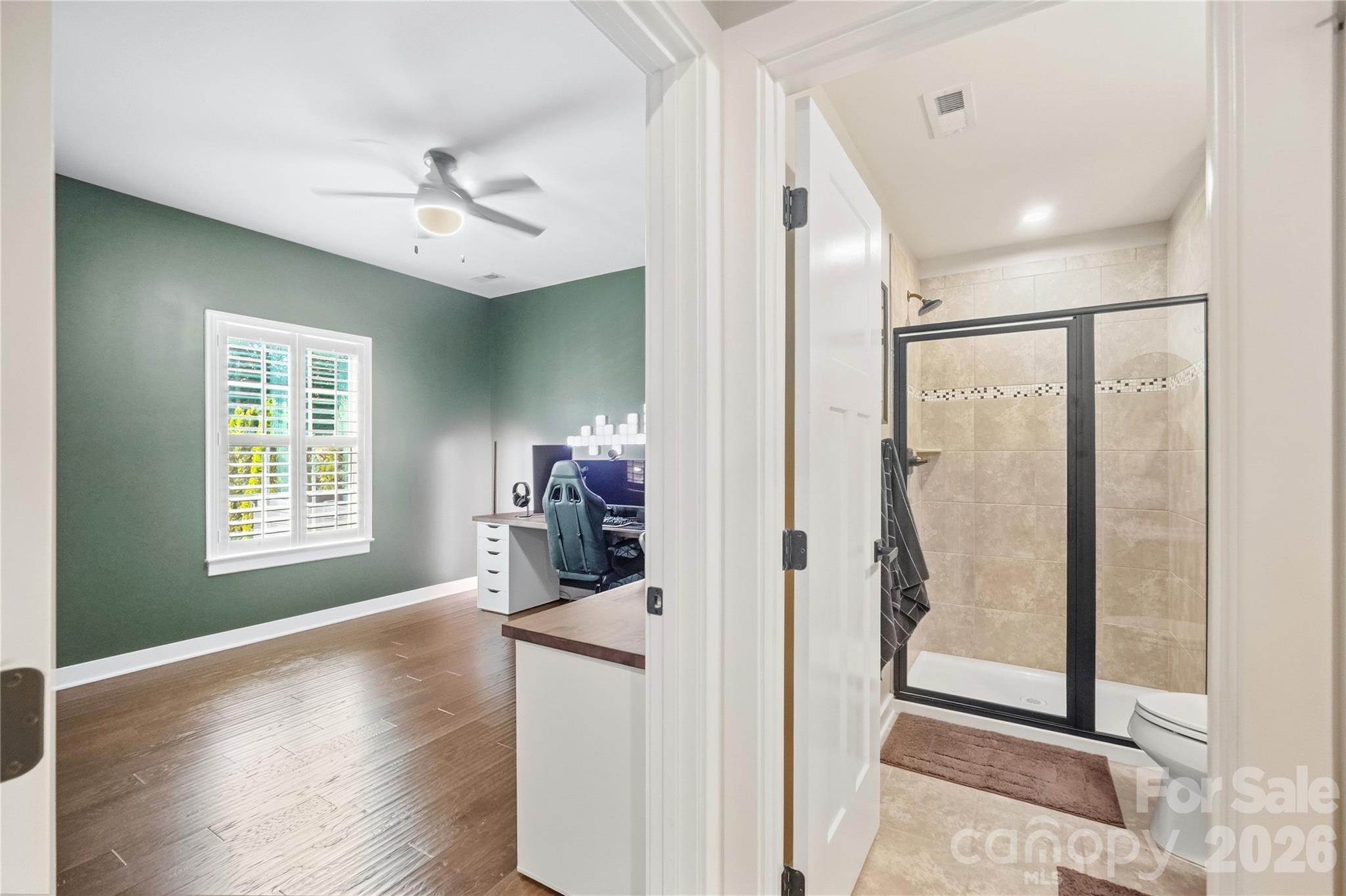 Main-level study with a full bath just steps away, an easy setup for a guest space, home gym, or second office. - 912 Manorwood Drive, Waxhaw