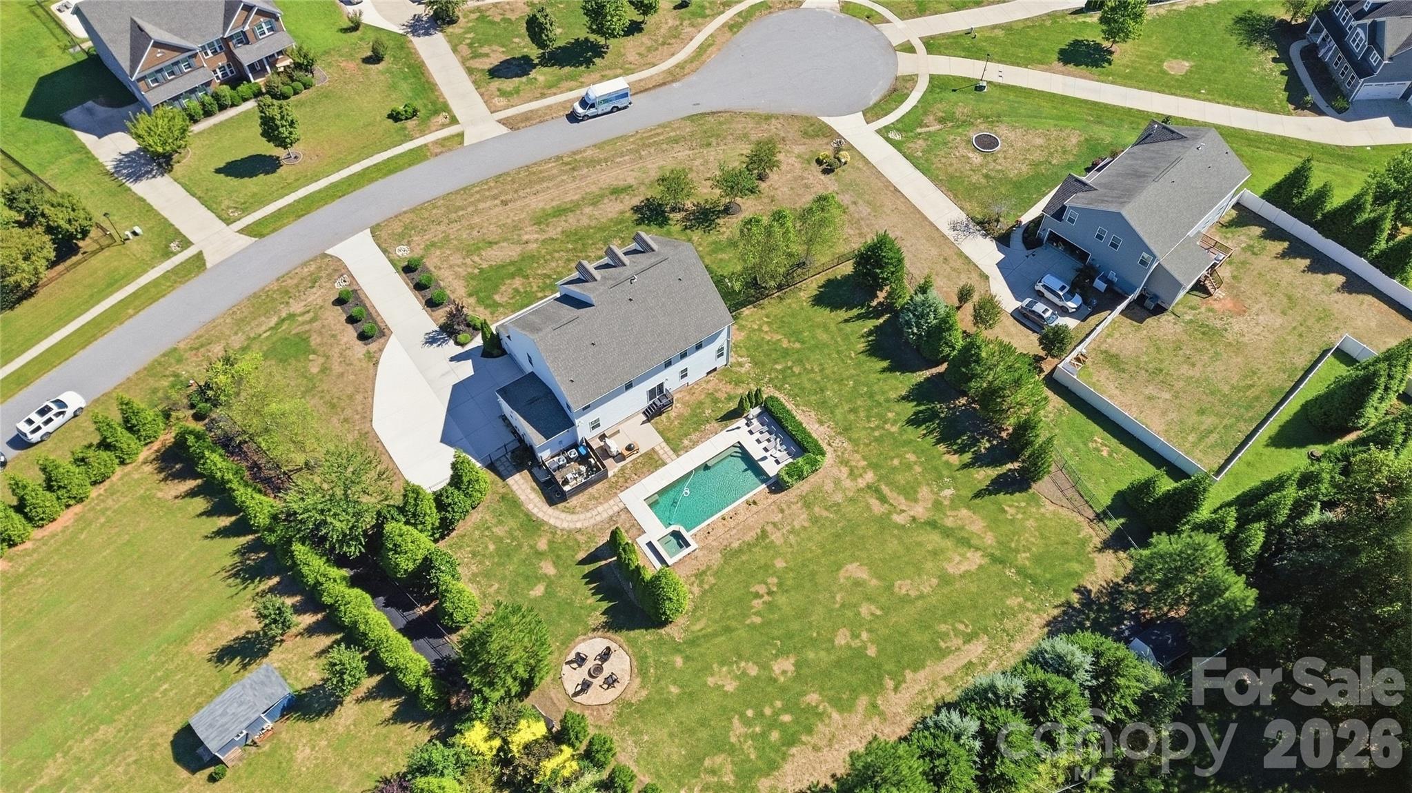 A 0.94-acre homesite with an expanded driveway and a deep, fully fenced backyard offering a remarkable amount of usable outdoor space. - 912 Manorwood Drive, Waxhaw
