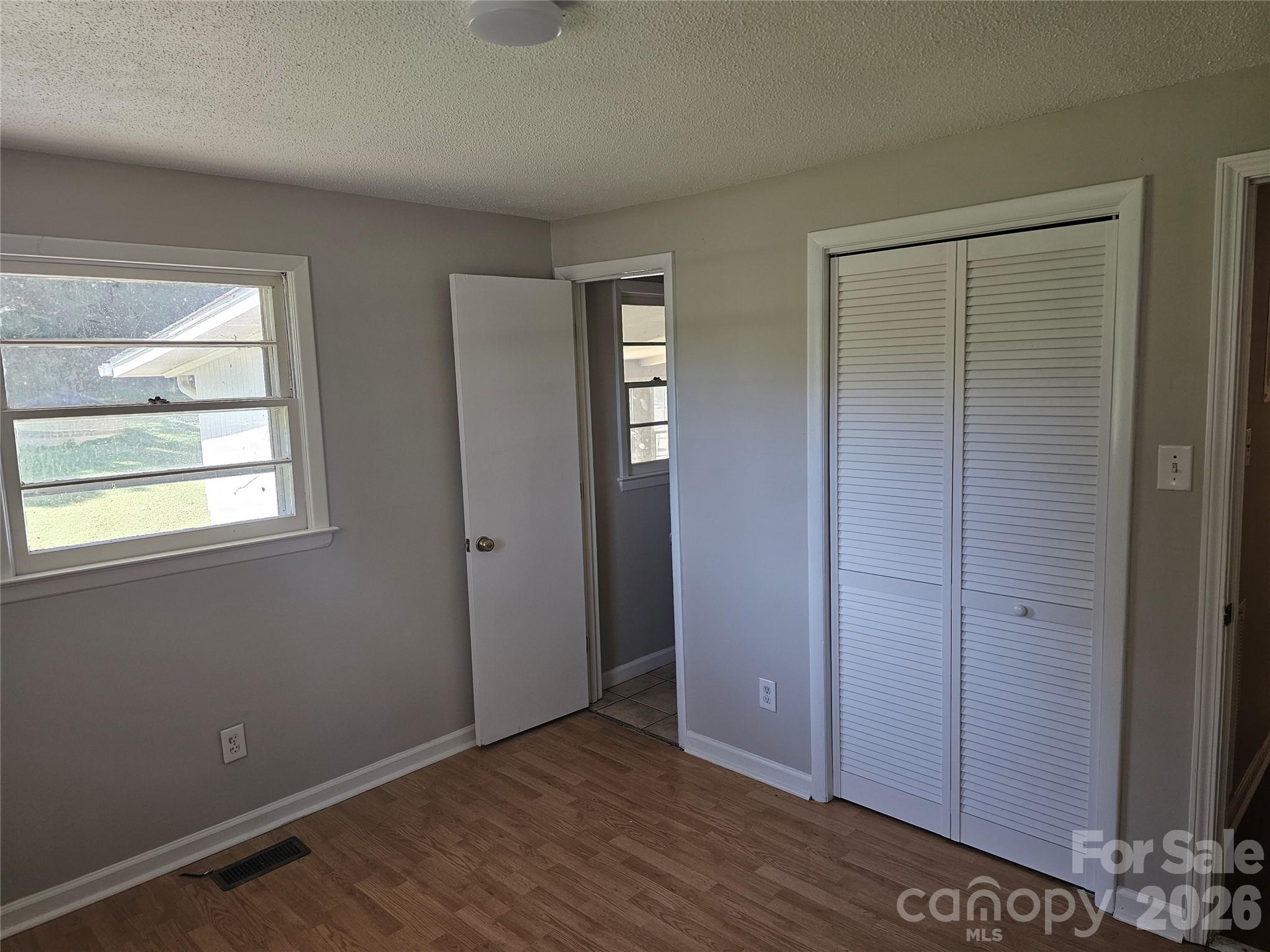 Primary bedroom with half bath - 2782 West View Street, Hickory