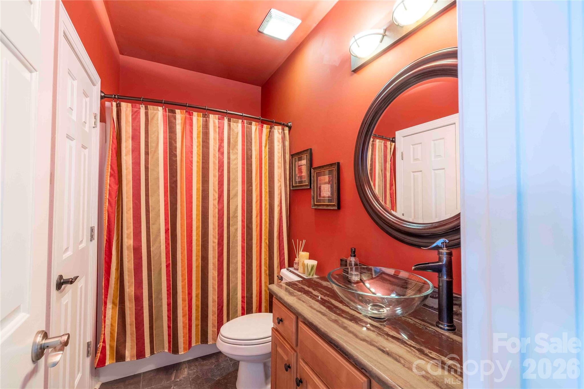 Main level dual-access full bathroom - 19008 Hampton Woods Court, Cornelius