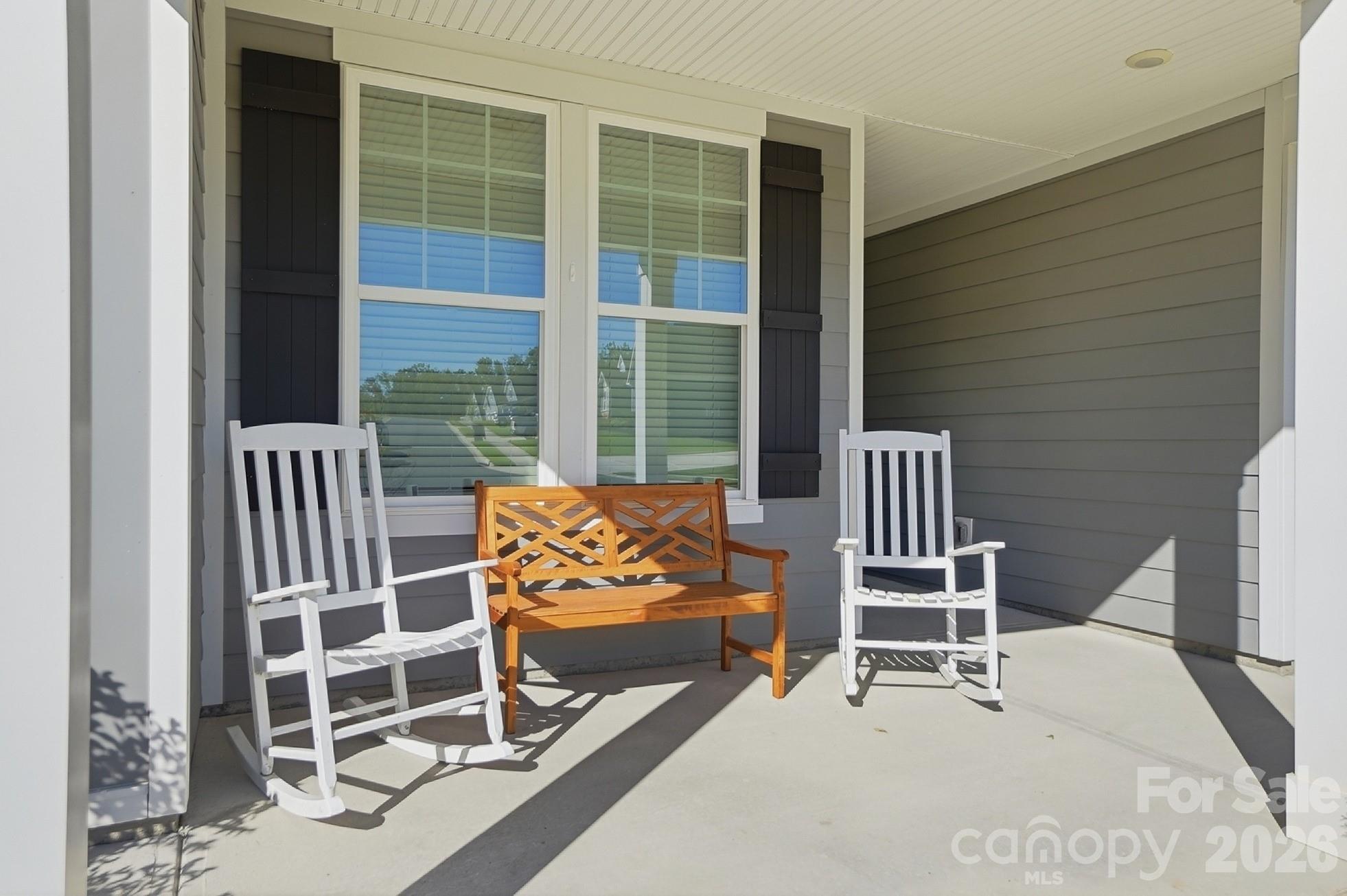 Welcoming rocking chair front porch - 8032 Longwaters Court, York