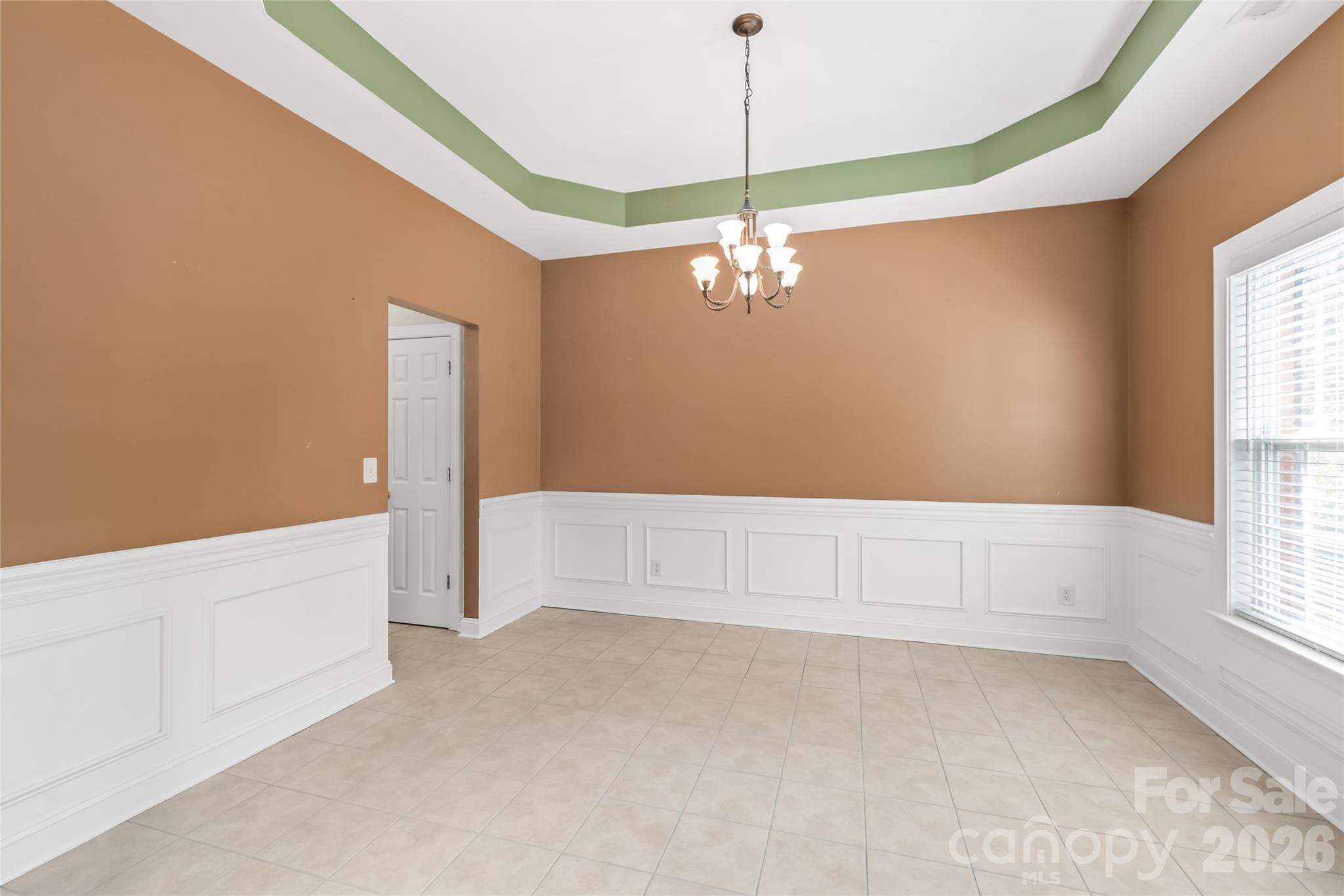 Designed for effortless entertaining, the dining room offers seamless, direct access to the chef’s kitchen. - 2008 Trace Creek Drive, Waxhaw