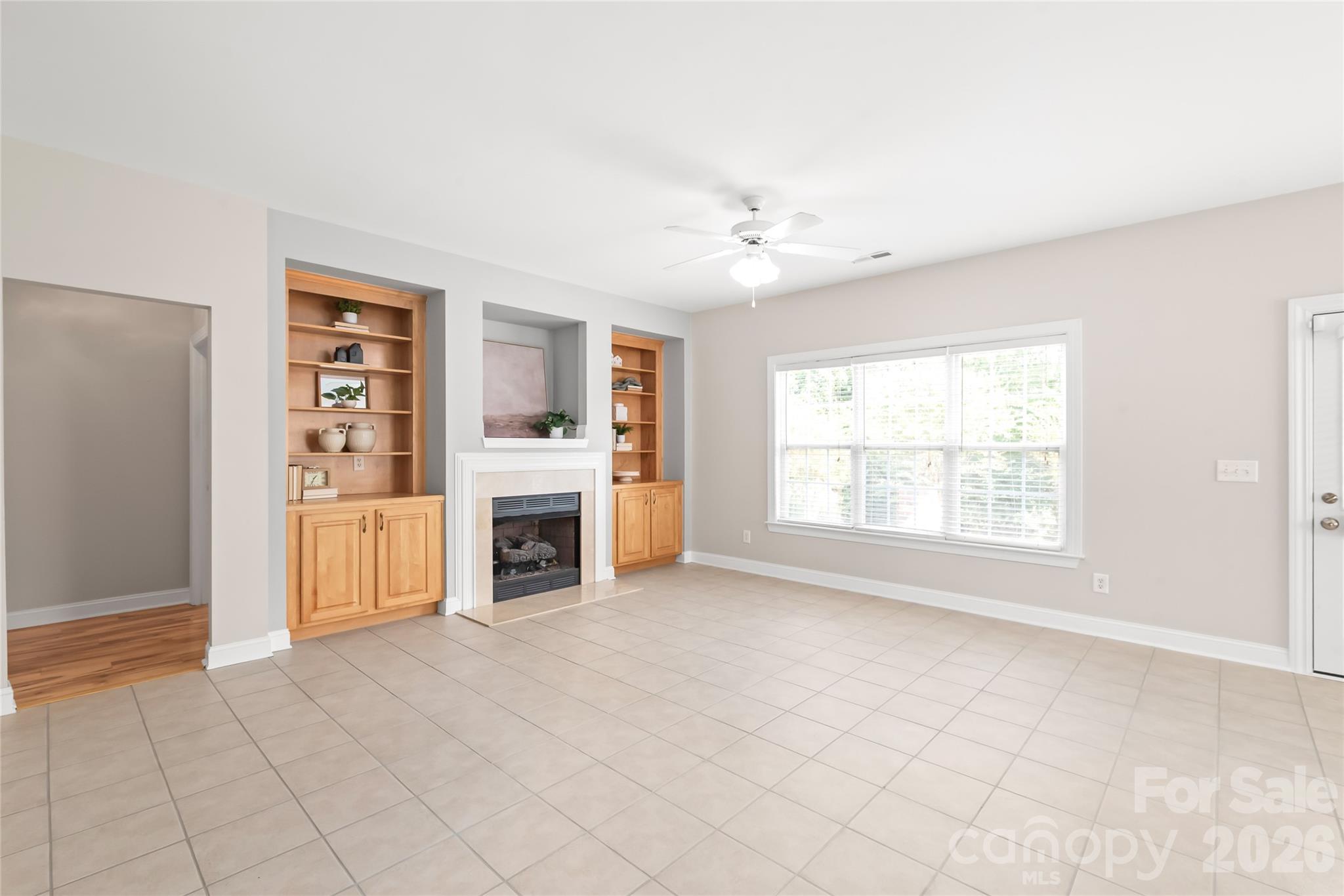 Tucked quietly off the living room on the main level, the primary suite serves as your own private sanctuary. - 2008 Trace Creek Drive, Waxhaw
