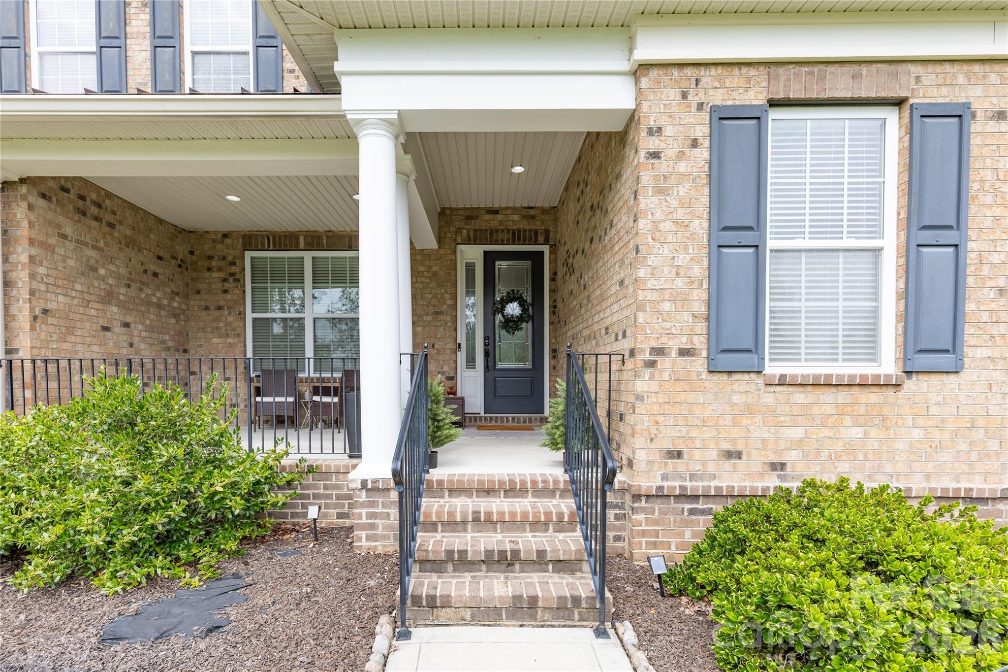 Covered front entry - 1402 Smoketree Court, Waxhaw