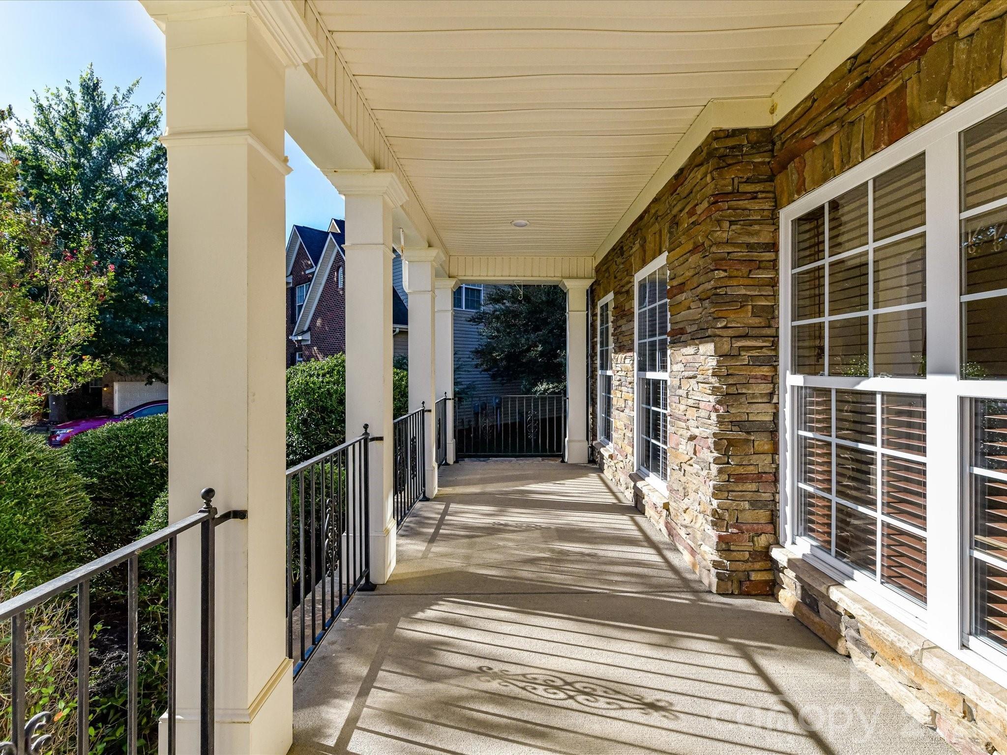 This east facing porch welcomes the morning sun! - 8128 Madrigal Court, Waxhaw