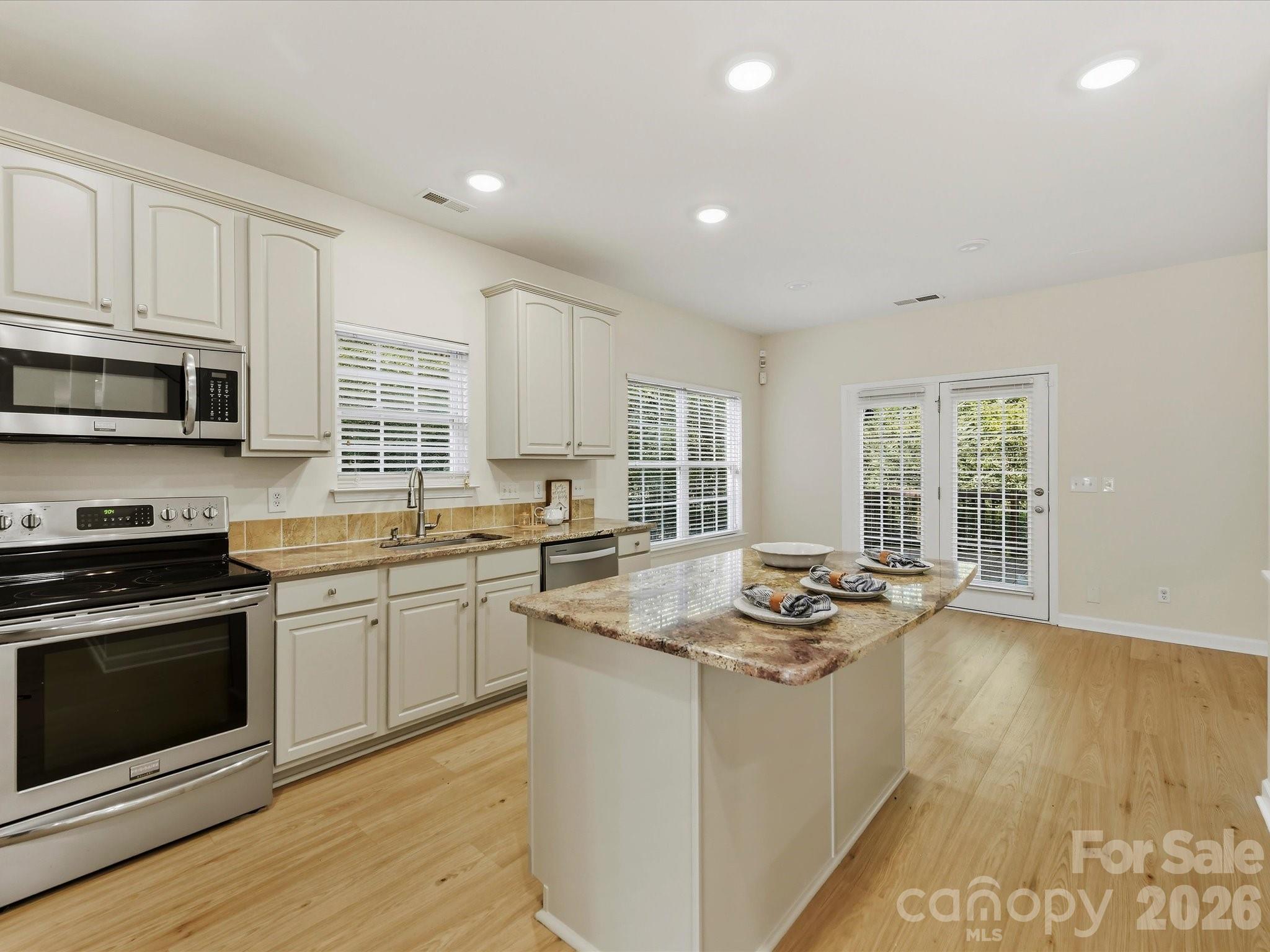 Stainless Steel Appliances and large movement granite are featured - 8128 Madrigal Court, Waxhaw