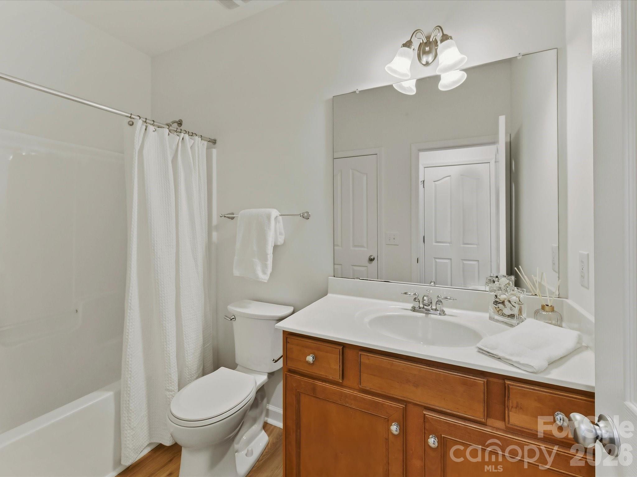 A full Bath on the main offers a private entrance to the guest bedroom - 8128 Madrigal Court, Waxhaw