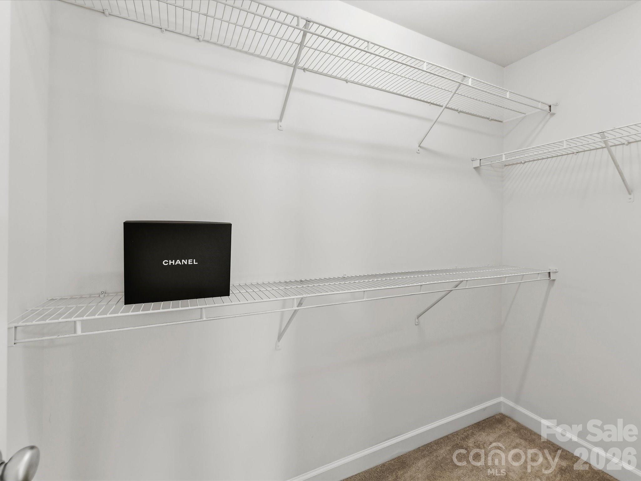 Two walk-in closets are featured off the Primary Bath - 8128 Madrigal Court, Waxhaw