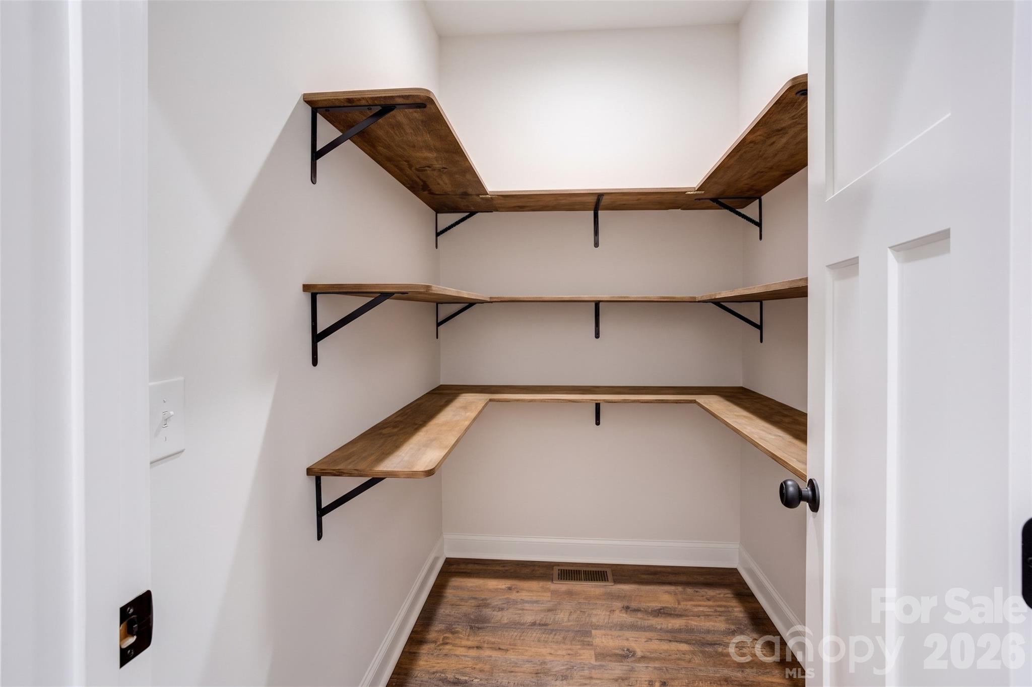 The eye is in the details! These custom wooden pantry shelves match your beautiful floors. - 317 Oak Brook Drive, Salisbury