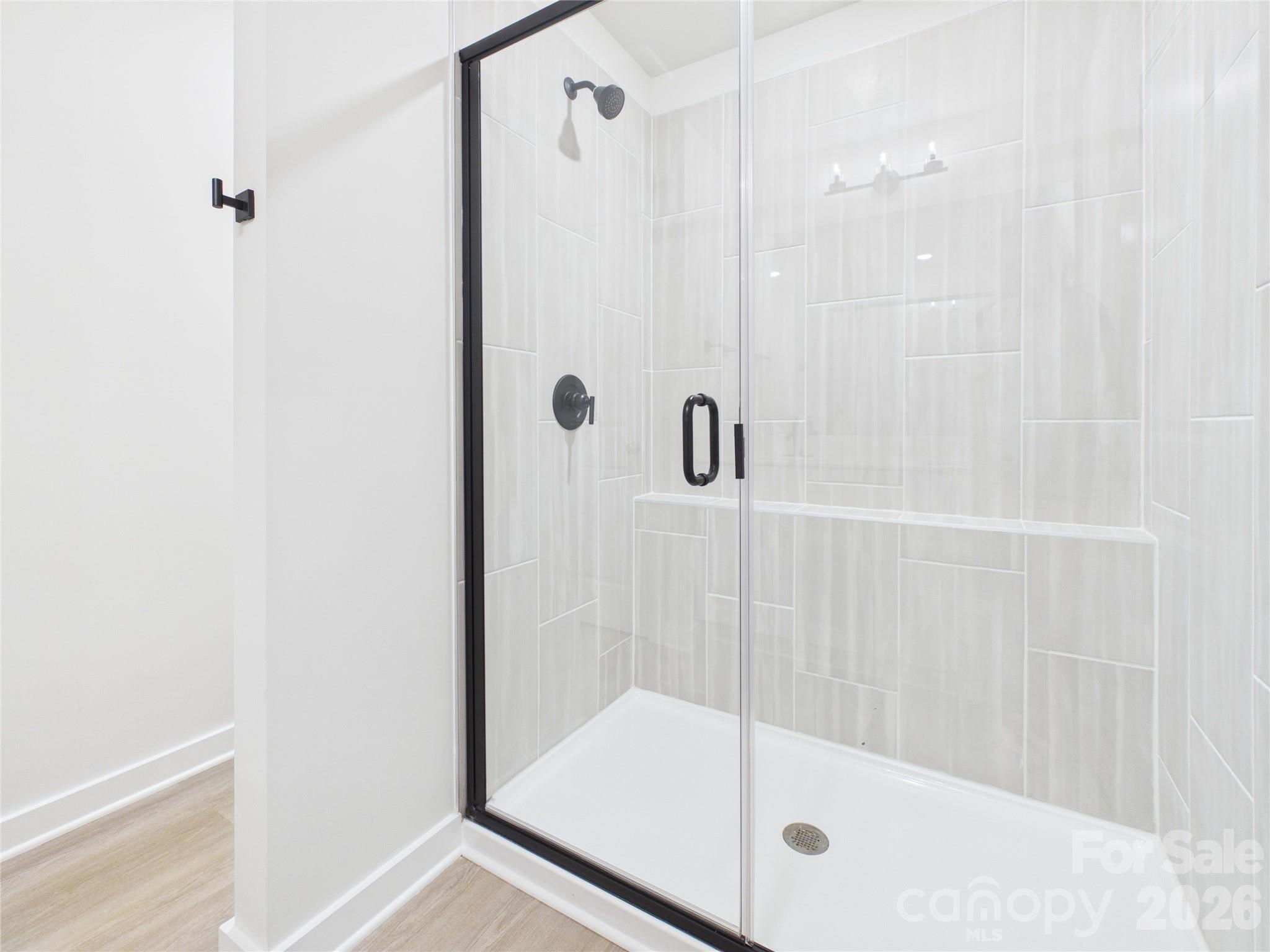 tiled shower in Primary Bath - 105 Dilling Street N, Kings Mountain