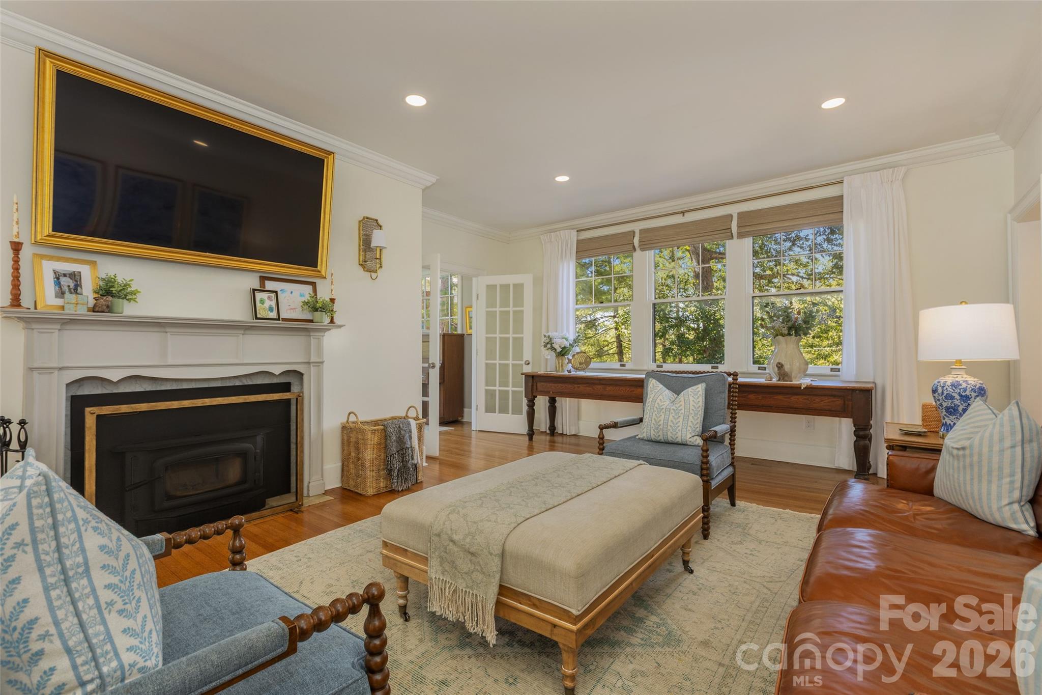 Living room with wood burning stove. - 200 Kimberly Avenue, Asheville
