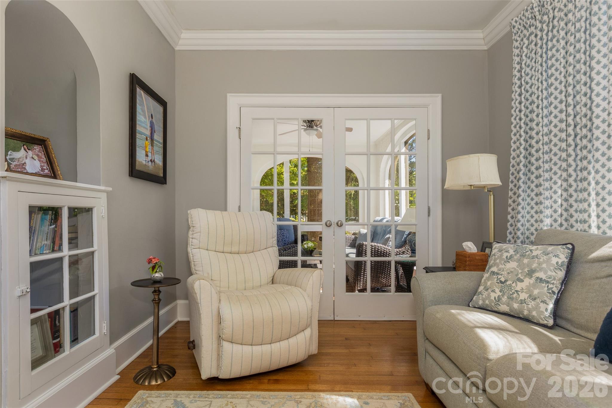 Sitting room with french doors into sunroom. - 200 Kimberly Avenue, Asheville