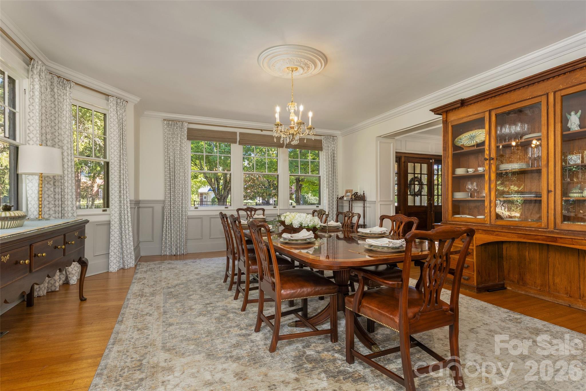 Dining room featuring original chandelier that was restored. - 200 Kimberly Avenue, Asheville