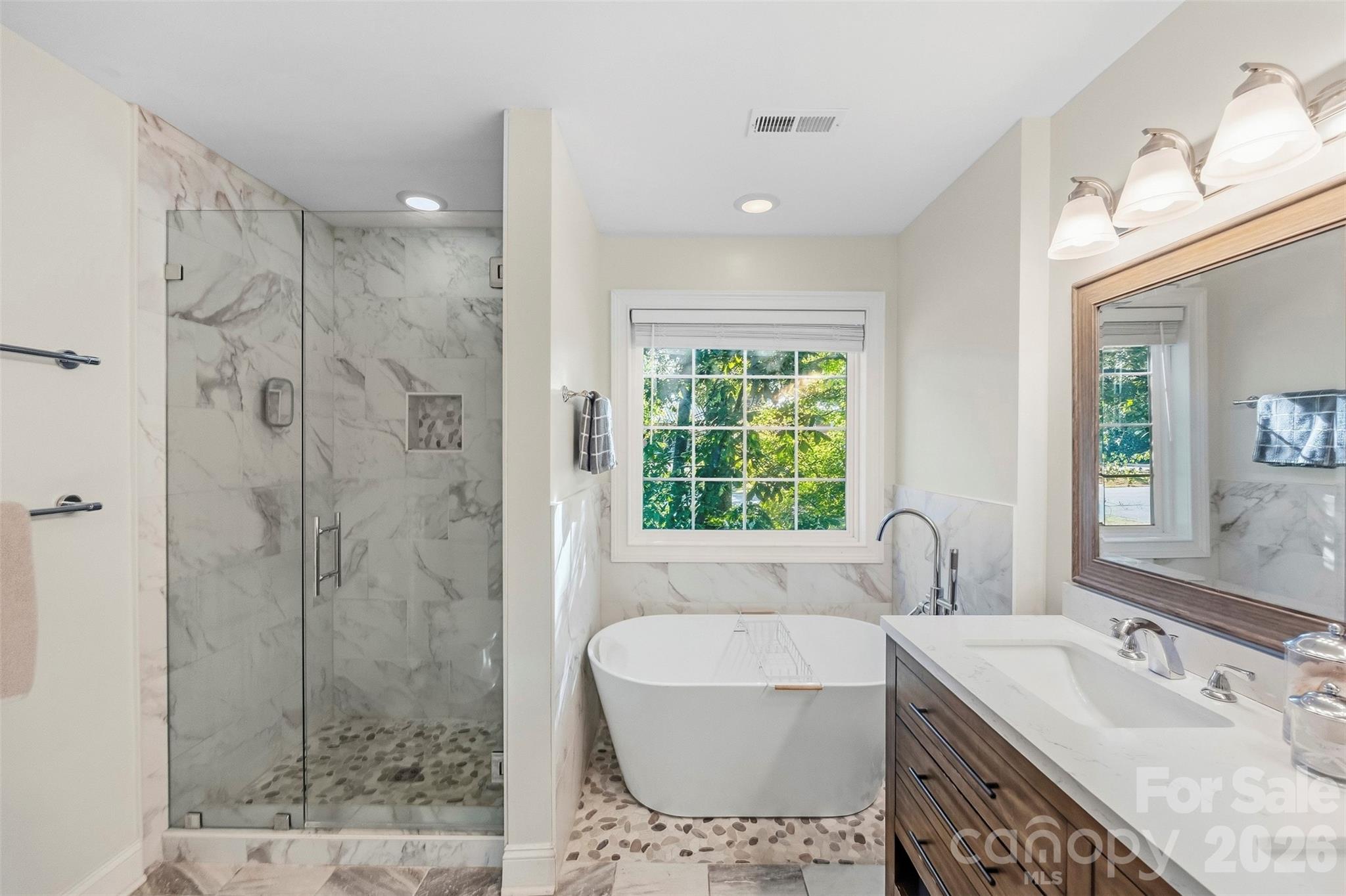 Primary bath with soaking tub and shower - 109 Fulton Farms Lane, Mooresville