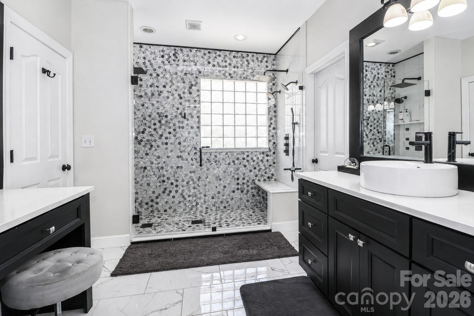 Plumbing for a 2nd sink already exists under the make up vanity in primary bath. - 109 Longboat Road, Mooresville