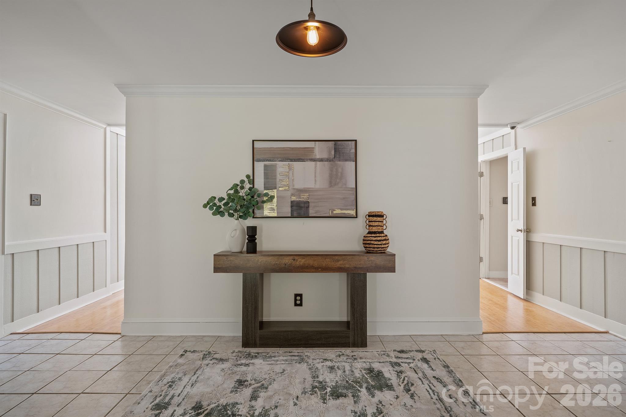 Entryway is flanked by DR to the left and powder bath and large closet then laundry to your right - 20919 Island Forest Drive, Cornelius