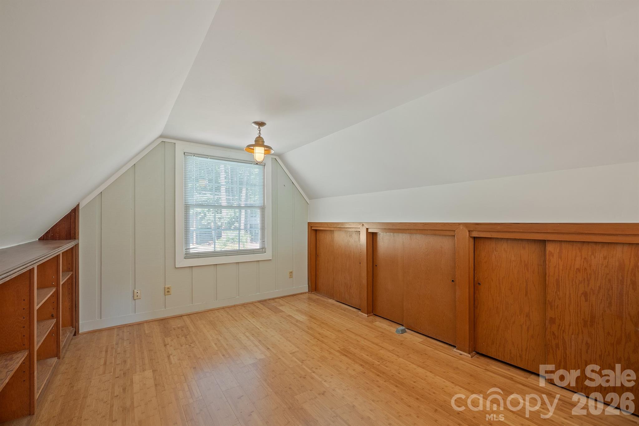 The loft off the Great room offers storage, bookshelves a reading nook, playroom or another home office or even room for kids to bunk - 20919 Island Forest Drive, Cornelius
