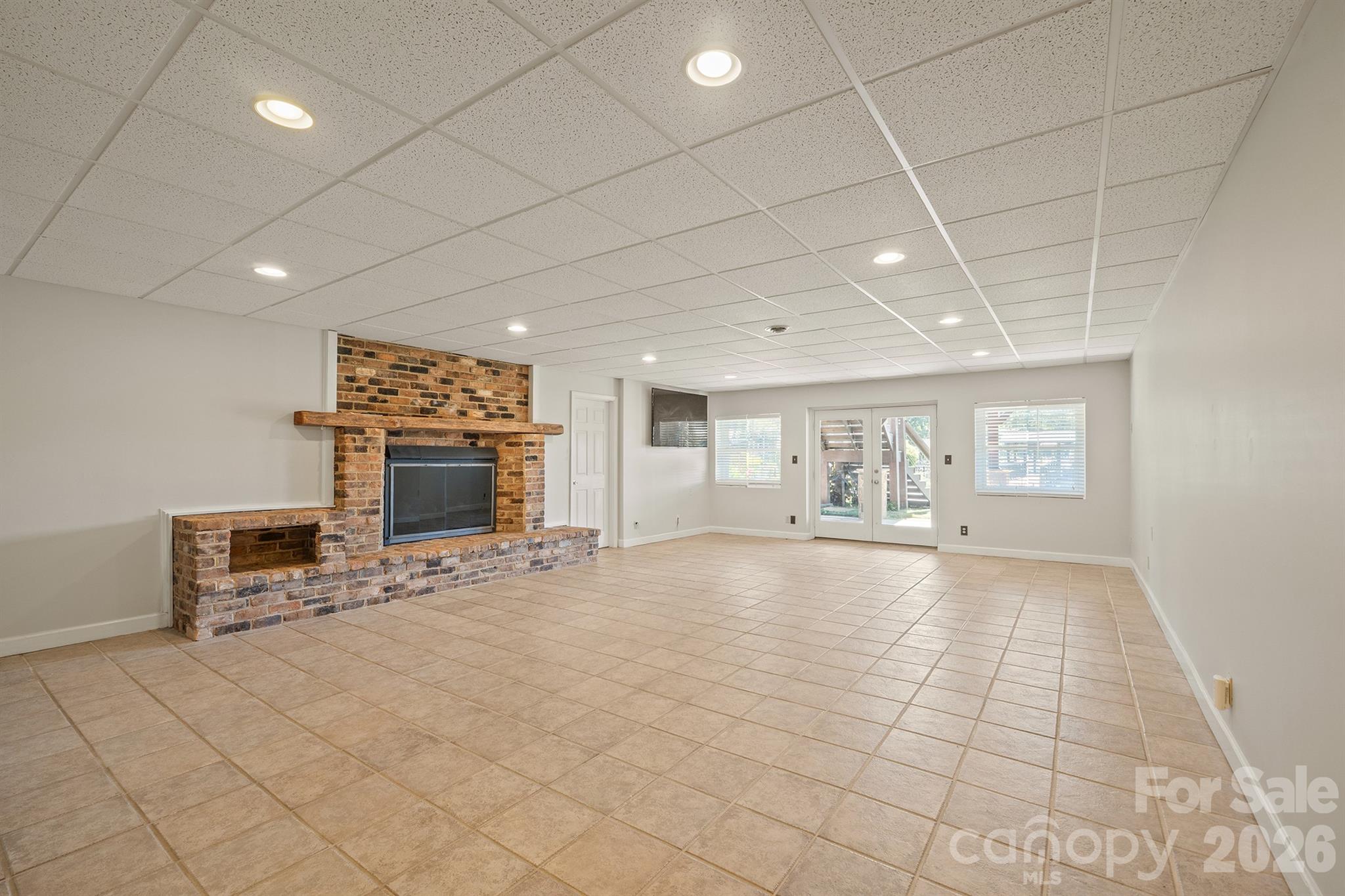 Down to your basement with second Brick fp and gas logs tiled flooring and easy outdoor acess - 20919 Island Forest Drive, Cornelius