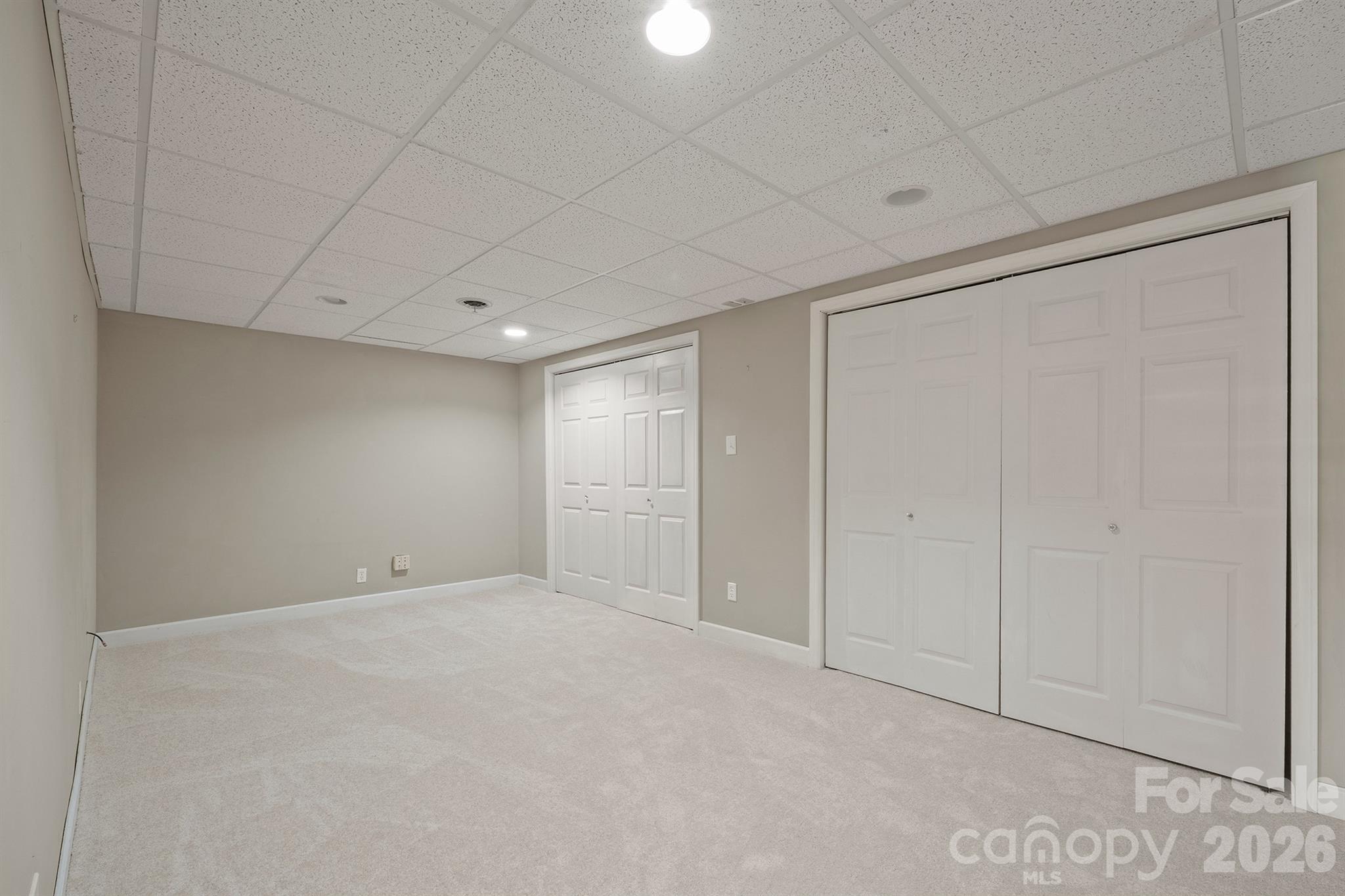 Flex room behind stairway to basement can be additional sleeping quarters or that pefect movie room or game room - 20919 Island Forest Drive, Cornelius