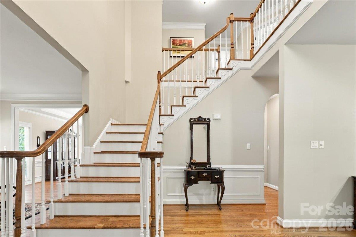 open foyer with gleaming hardwood floors - 178 Cove Creek Loop, Mooresville