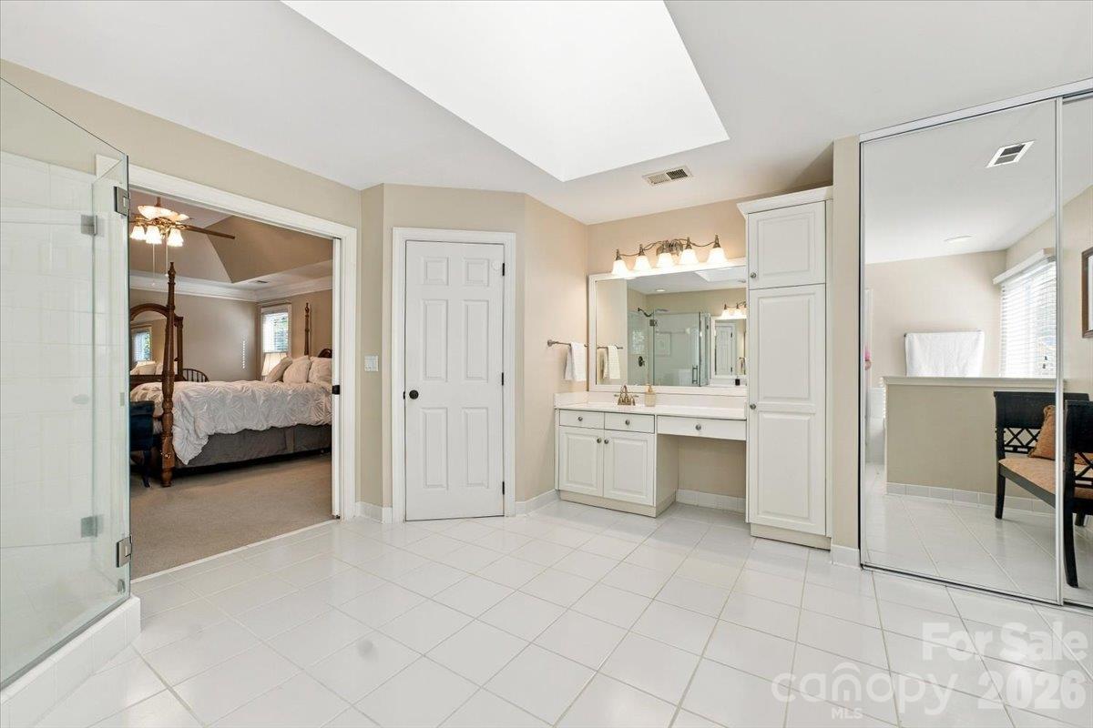 Lovely primary bath with lots of space and a skylight for extra light. - 178 Cove Creek Loop, Mooresville