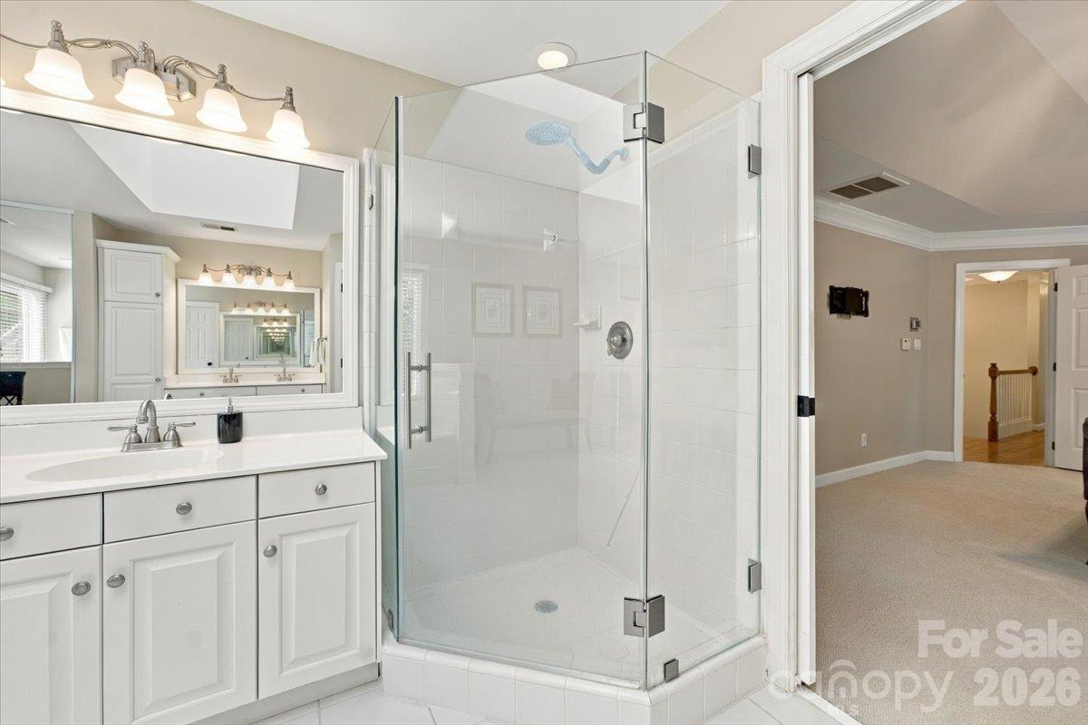 Lovely primary bath with lots of space and a skylight for extra light. - 178 Cove Creek Loop, Mooresville