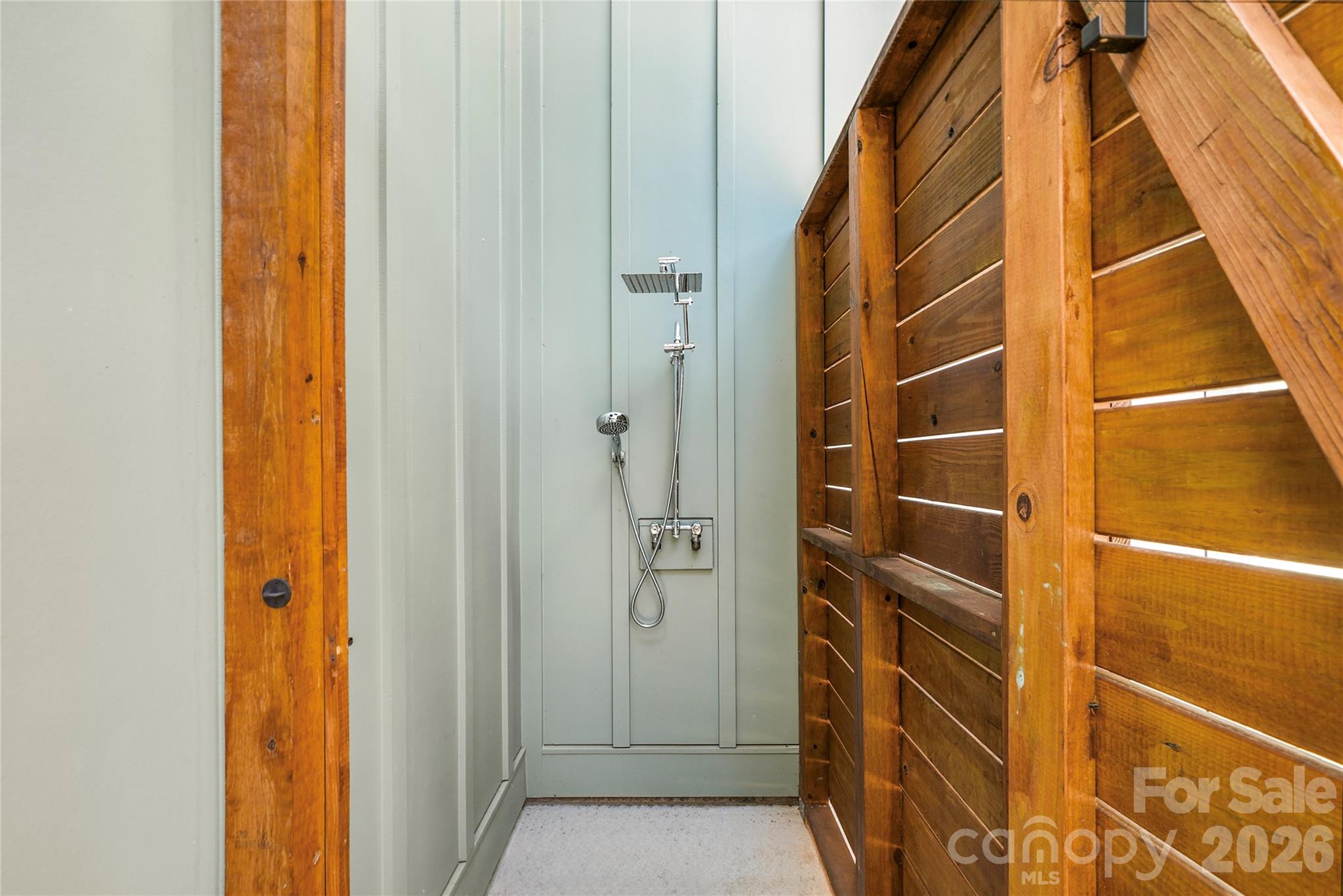 Outdoor shower offers a convenient place to rinse off after enjoying the pool or a day on the lake. - 143 Hideaway Lane, Mooresville