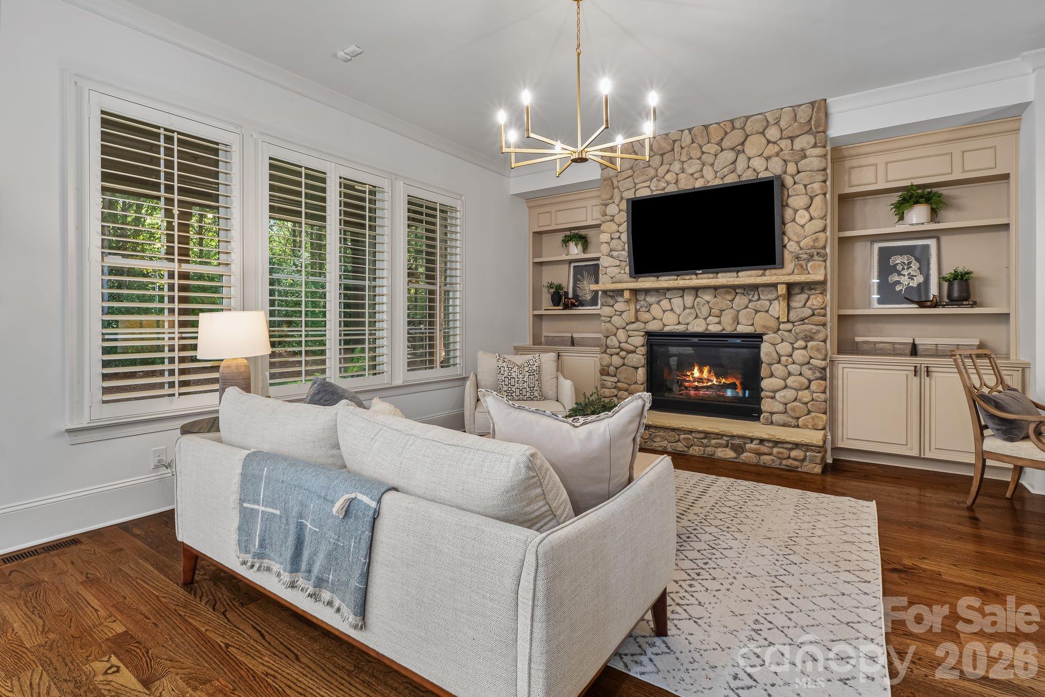 Keeping room has beautiful stone fireplace detailing - 227 Glenmoor Drive, Waxhaw