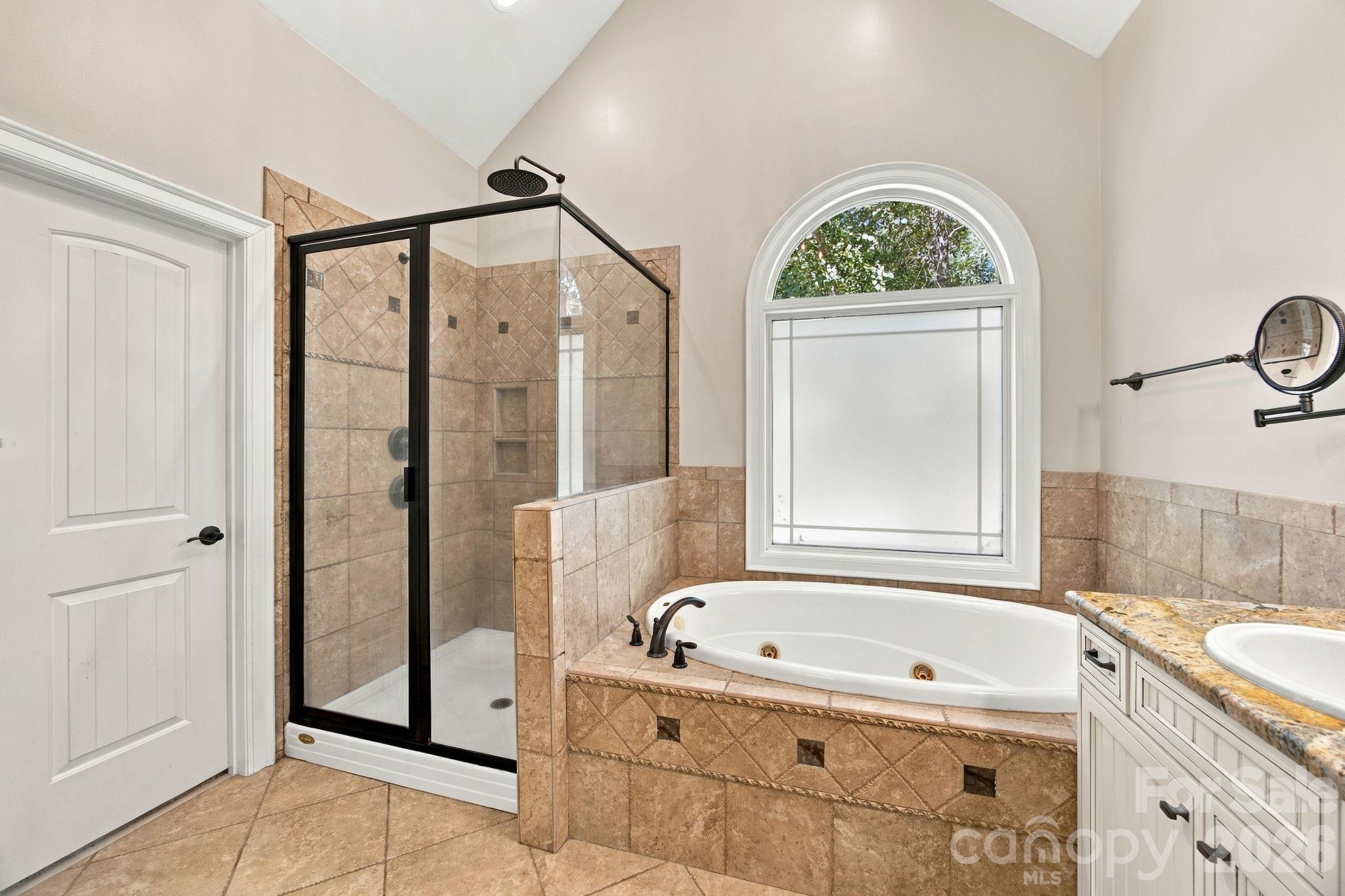Primary bath with separate tub and shower - 7481 Brotherton Road, Denver