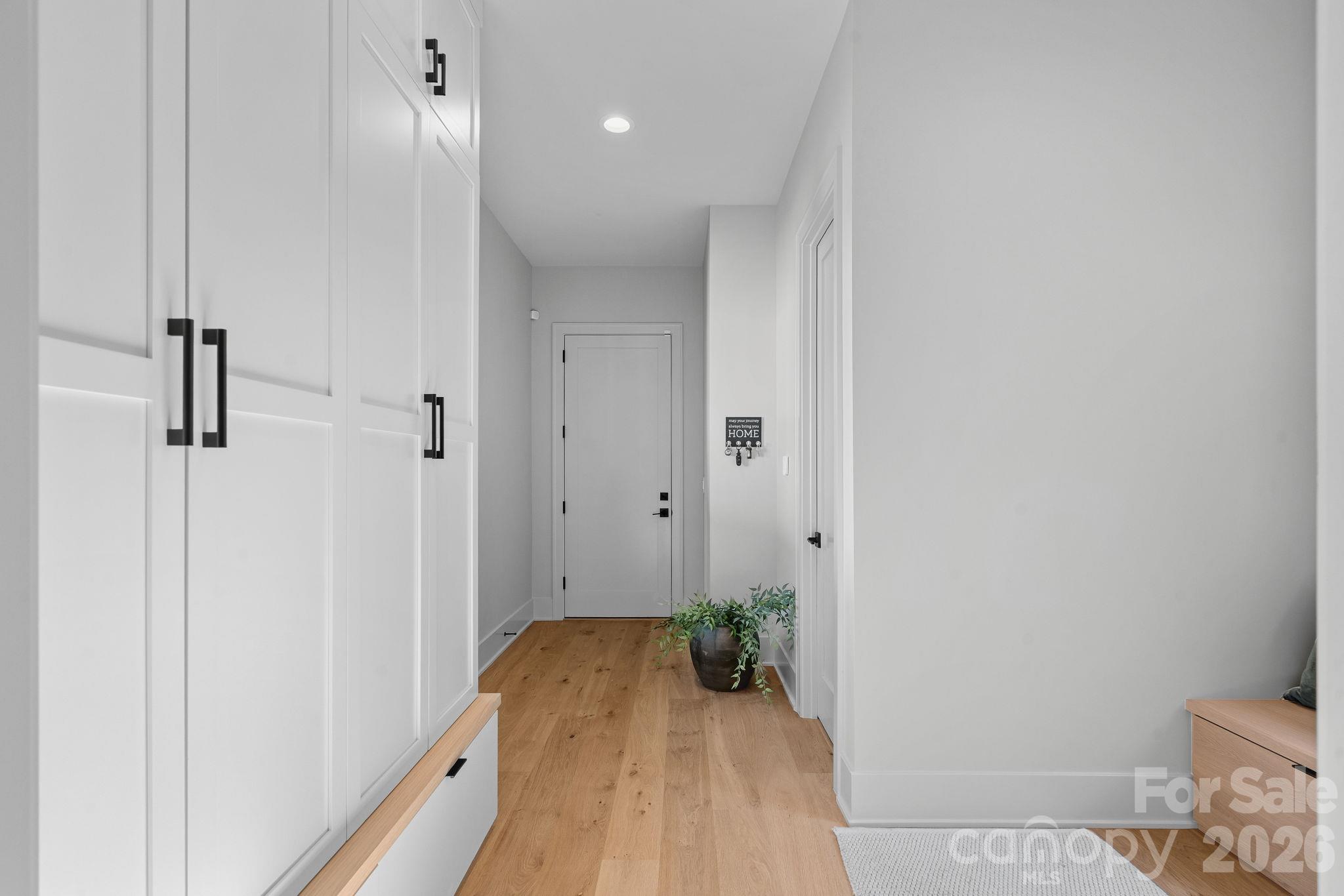 Designer drop zone with custom built-ins and integrated seating. - 17811 Largo Place, Cornelius