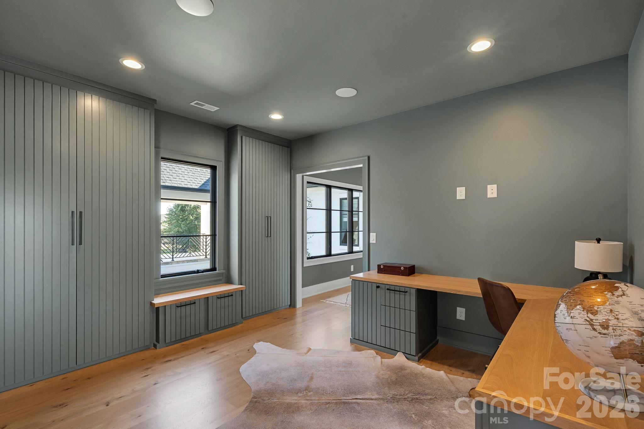 Thoughtfully designed flex space with tailored built-ins, generous storage and a dedicated workspace adaptable to everyday needs. - 17811 Largo Place, Cornelius