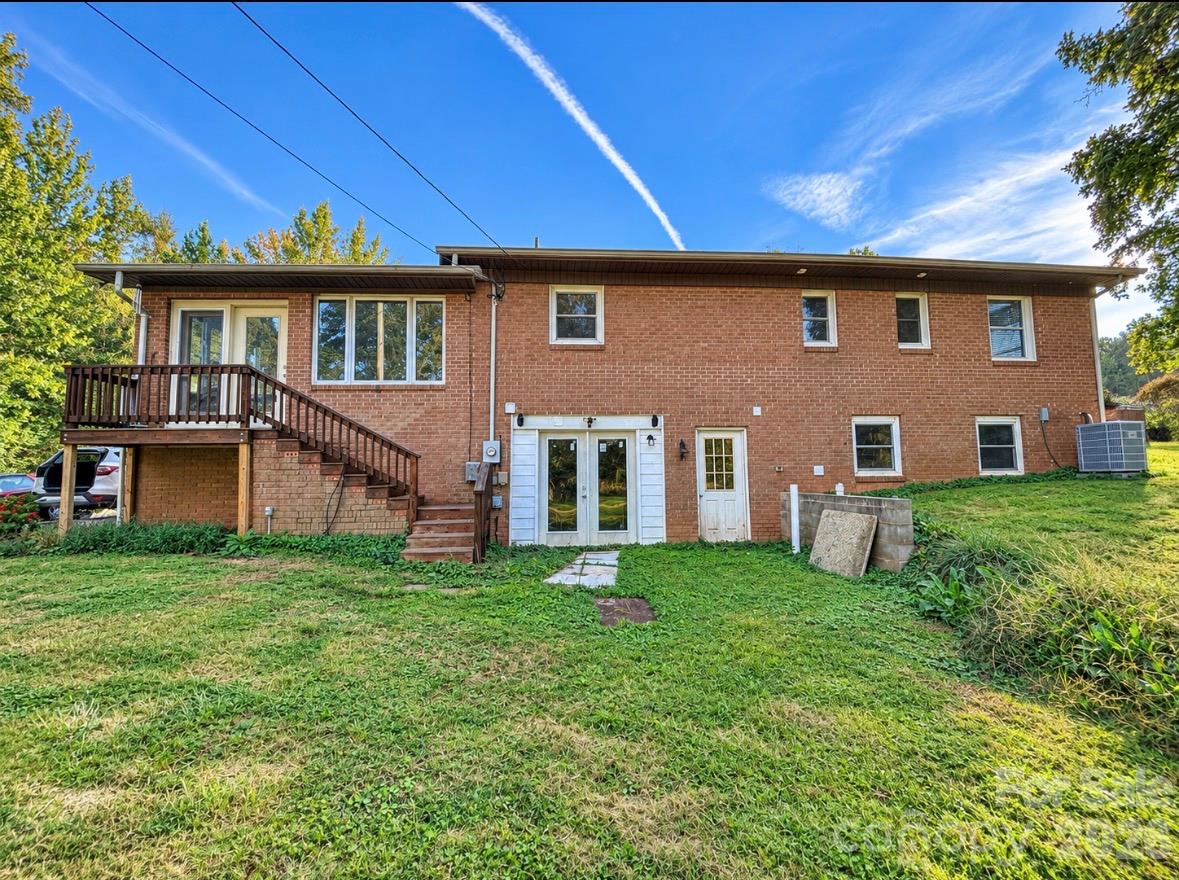 Back of home showing exterior basement door - 193 Bevis Lane, Statesville