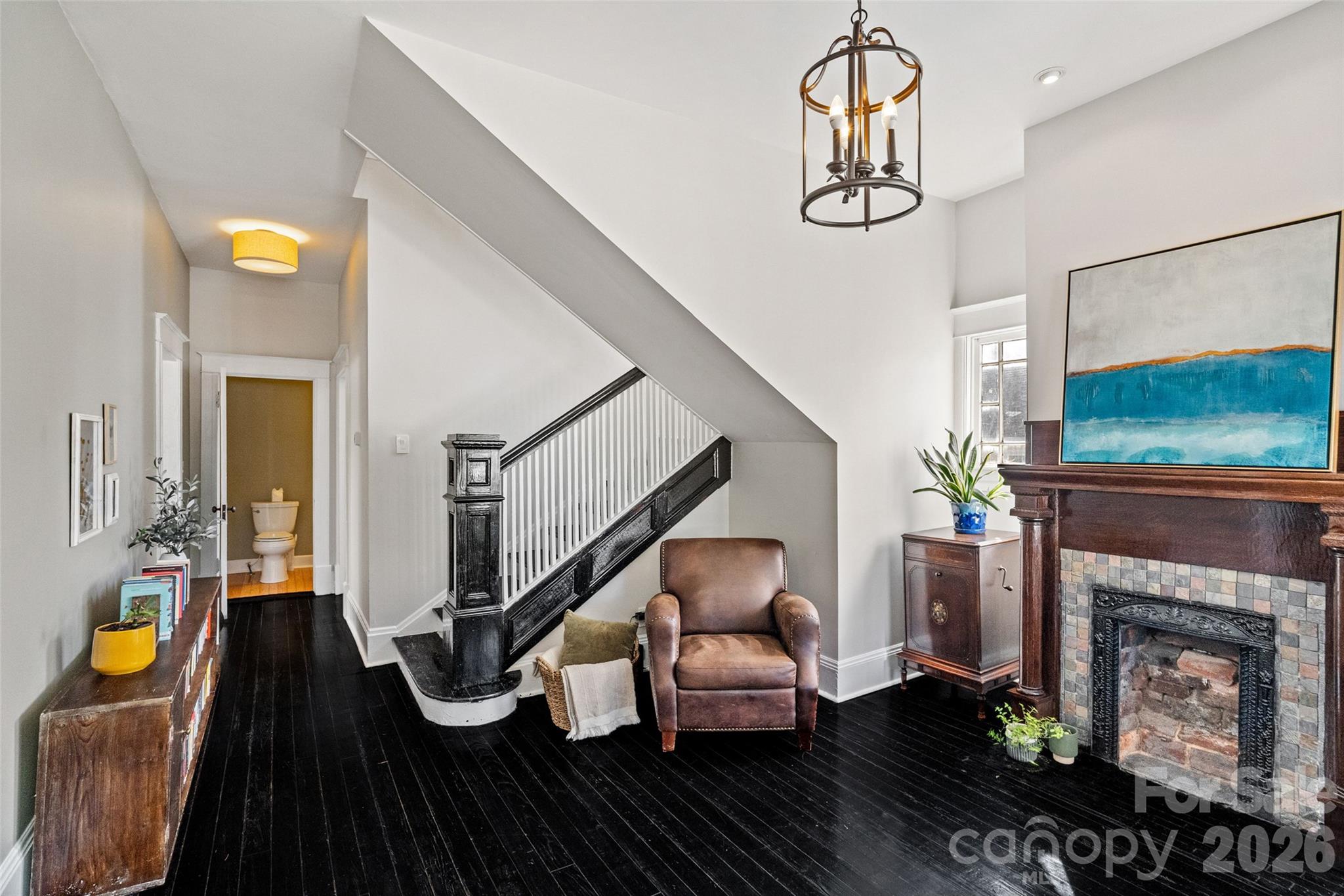 Grand foyer with fireplace, staircase, and original hardwoods - 233 Marion Street, Rock Hill