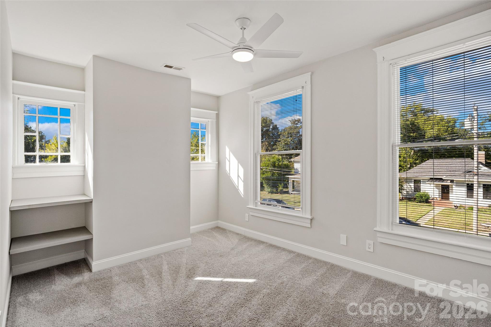 Bright bedroom with built-in shelving - 233 Marion Street, Rock Hill