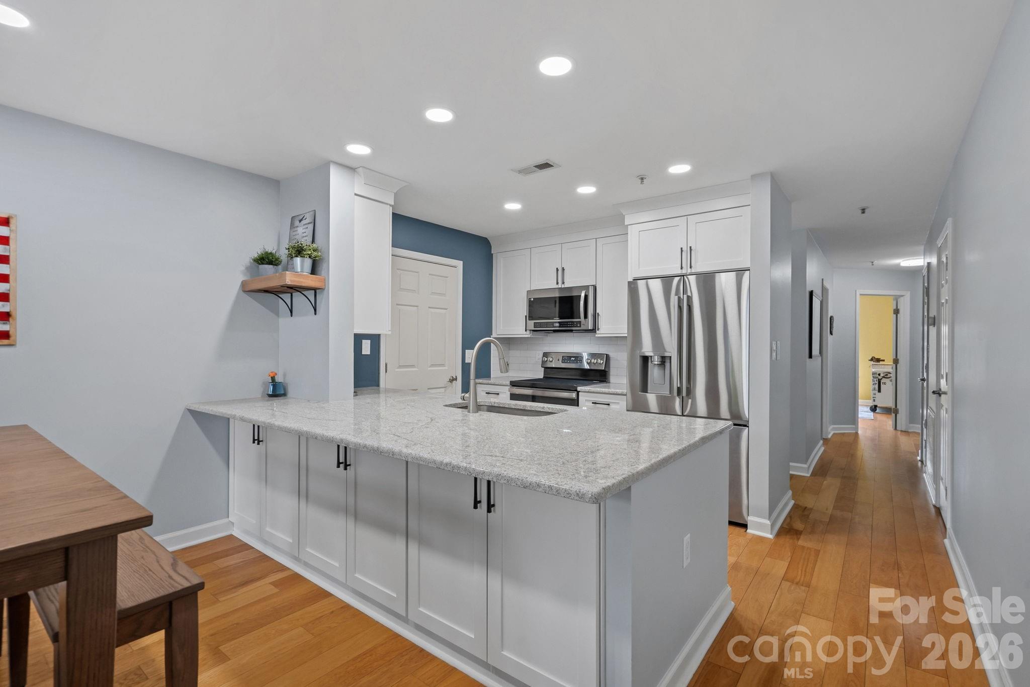 Updated Kitchen with Quartz Countertops, New SS appliances (2023) - 103 Pier 33 Drive, Mooresville