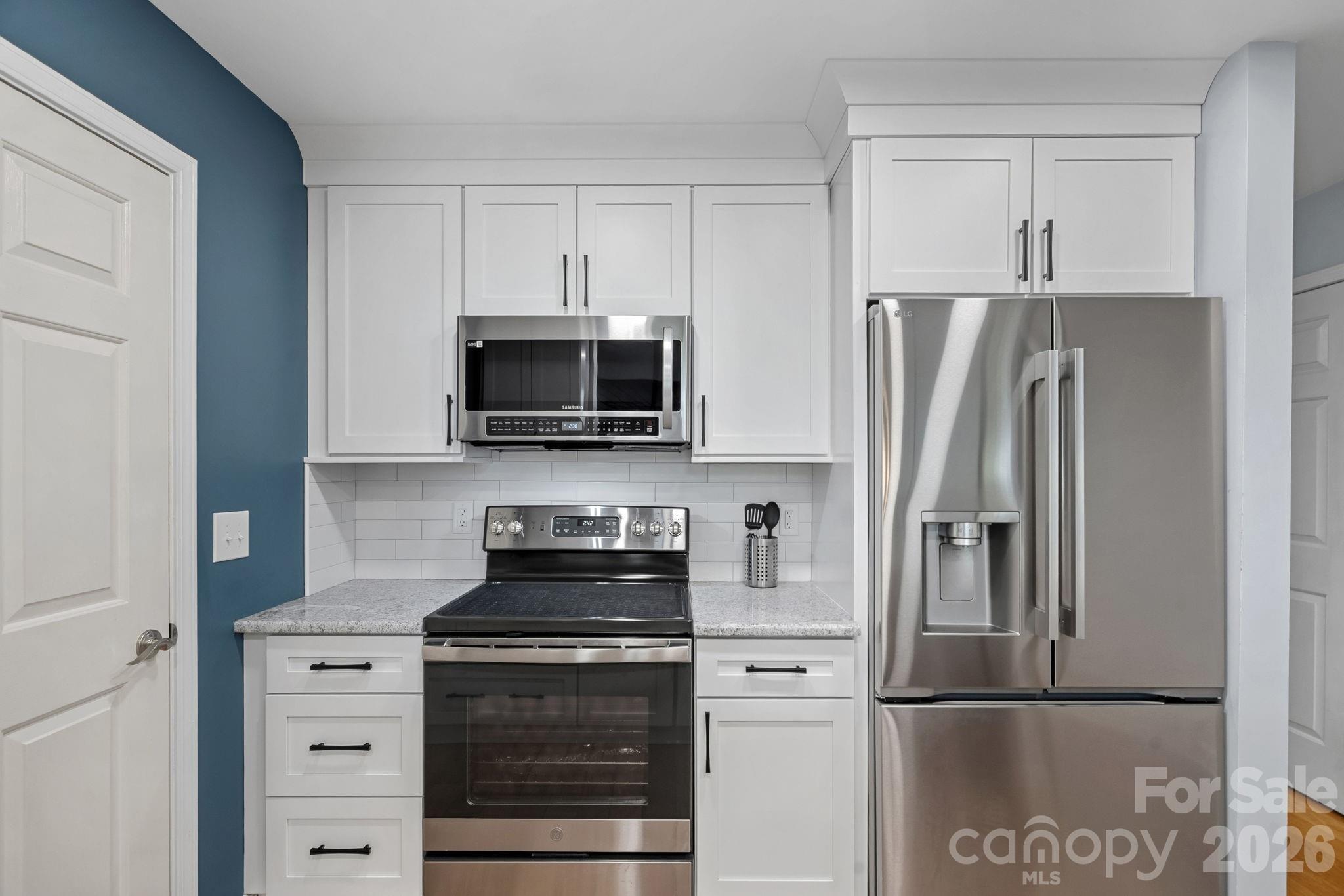 Updated Kitchen with Quartz Countertops, New SS appliances (2023) - 103 Pier 33 Drive, Mooresville