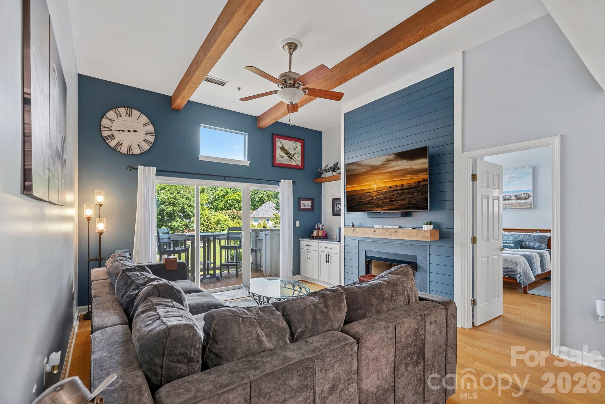 Spcious Living Space. Fireplace and new sliding glass door in 2022 - 103 Pier 33 Drive, Mooresville